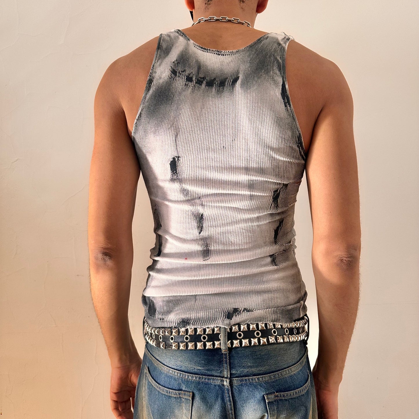 Back of ASTROBOI* x Hanes 'Hero' white ribbed cotton tank top with hand-painted black abstract graphic print and deconstructed cut-outs along chest and sides, customized at ASTROBOI* STUDIO in NYC.