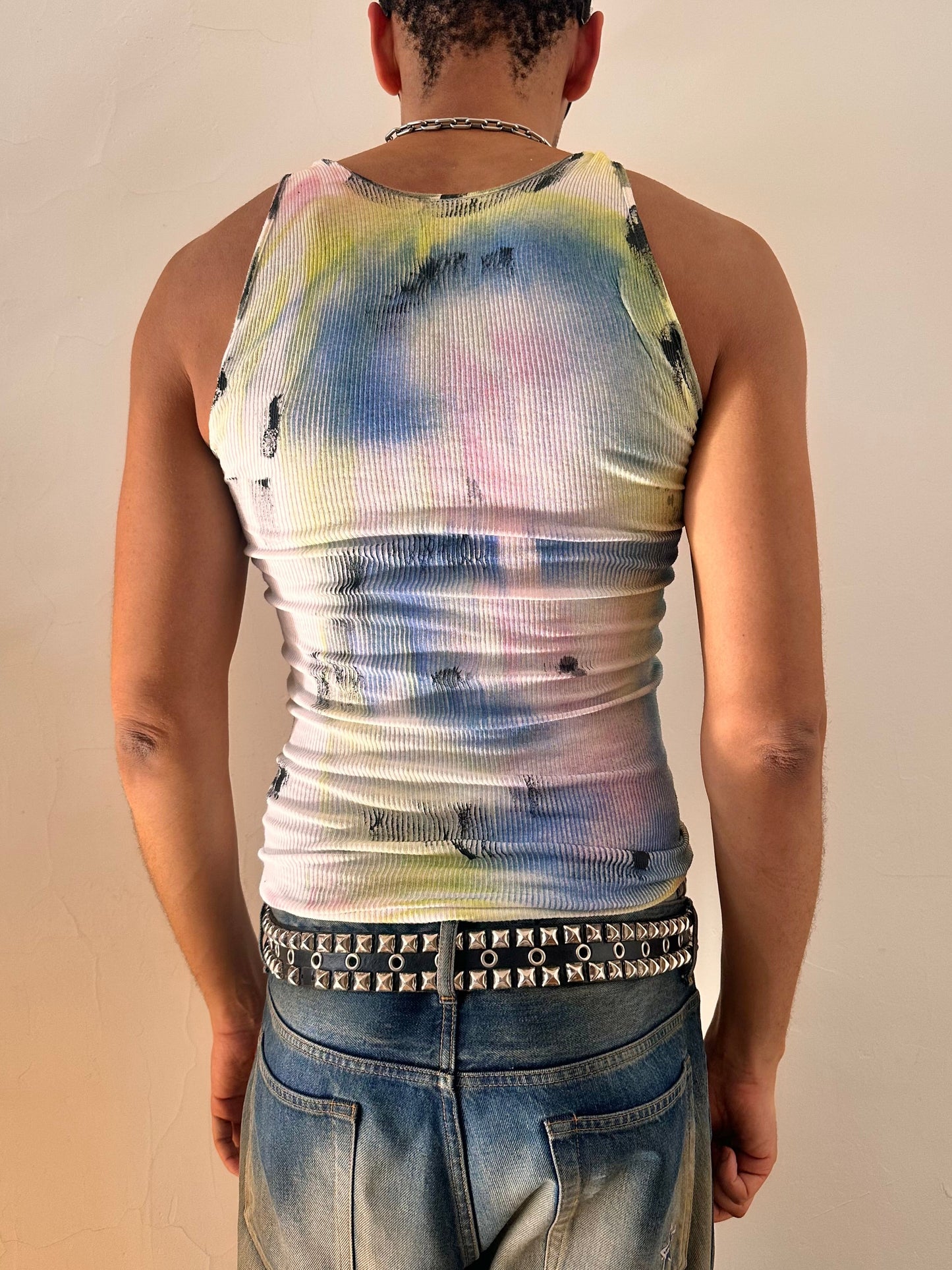 Back of of ASTROBOI* ‘Sunset’ white braided twist tank top with slashed detailing and a form-fitting silhouette. Handmade custom piece from ASTROBOI* STUDIO in NYC.