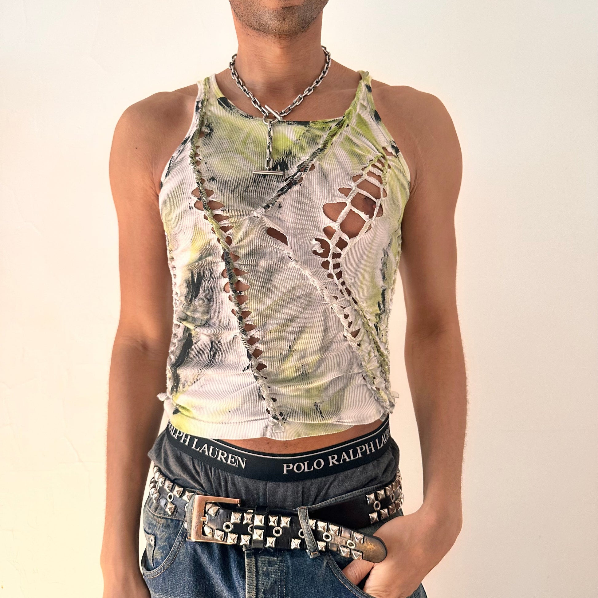 ASTROBOI* x Calvin Klein 'Brat' white braided twist tank top with slash detailing, raw hem, and green and black haze paint design, front view.