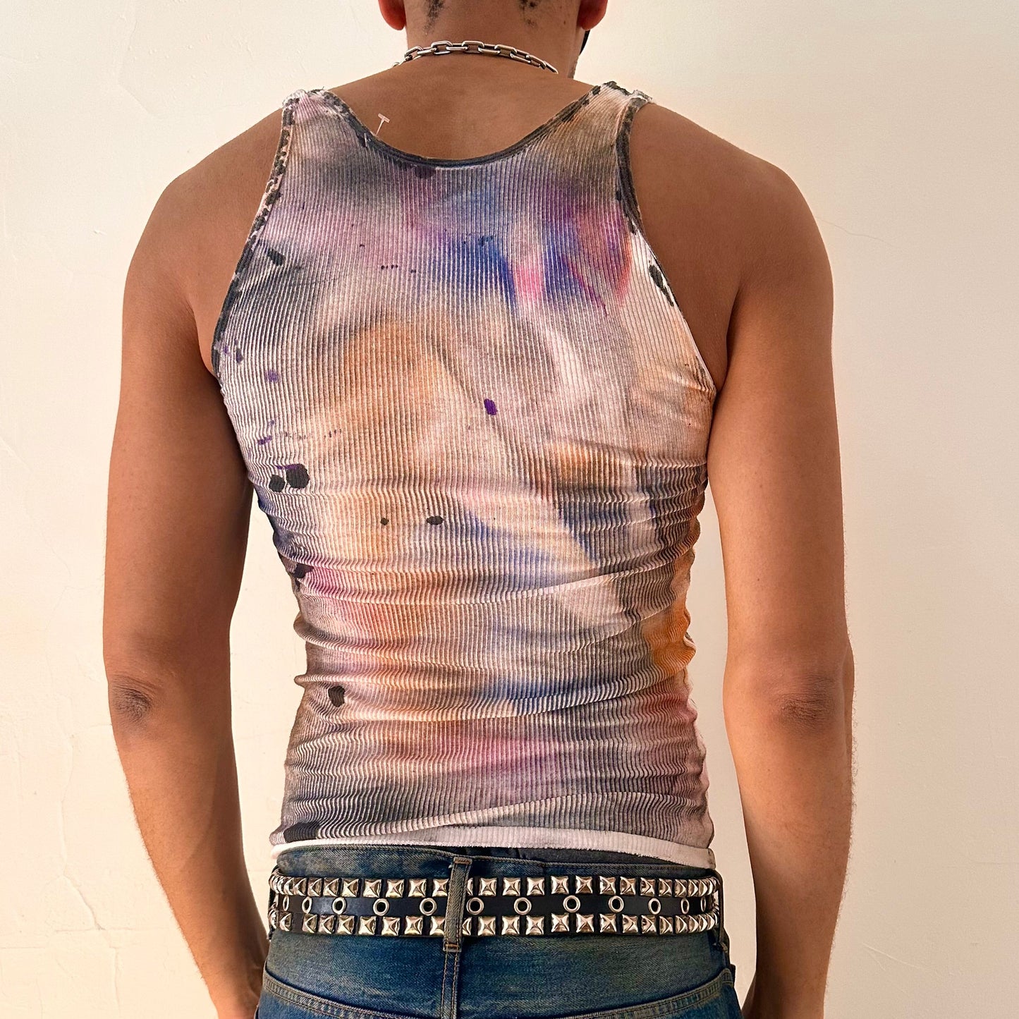 Back of ASTROBOI* x Hanes 'Spectrum' white slim-fit tank top with hand-painted multicolored graffiti graphic print throughout, customized at ASTROBOI* STUDIO in NYC.