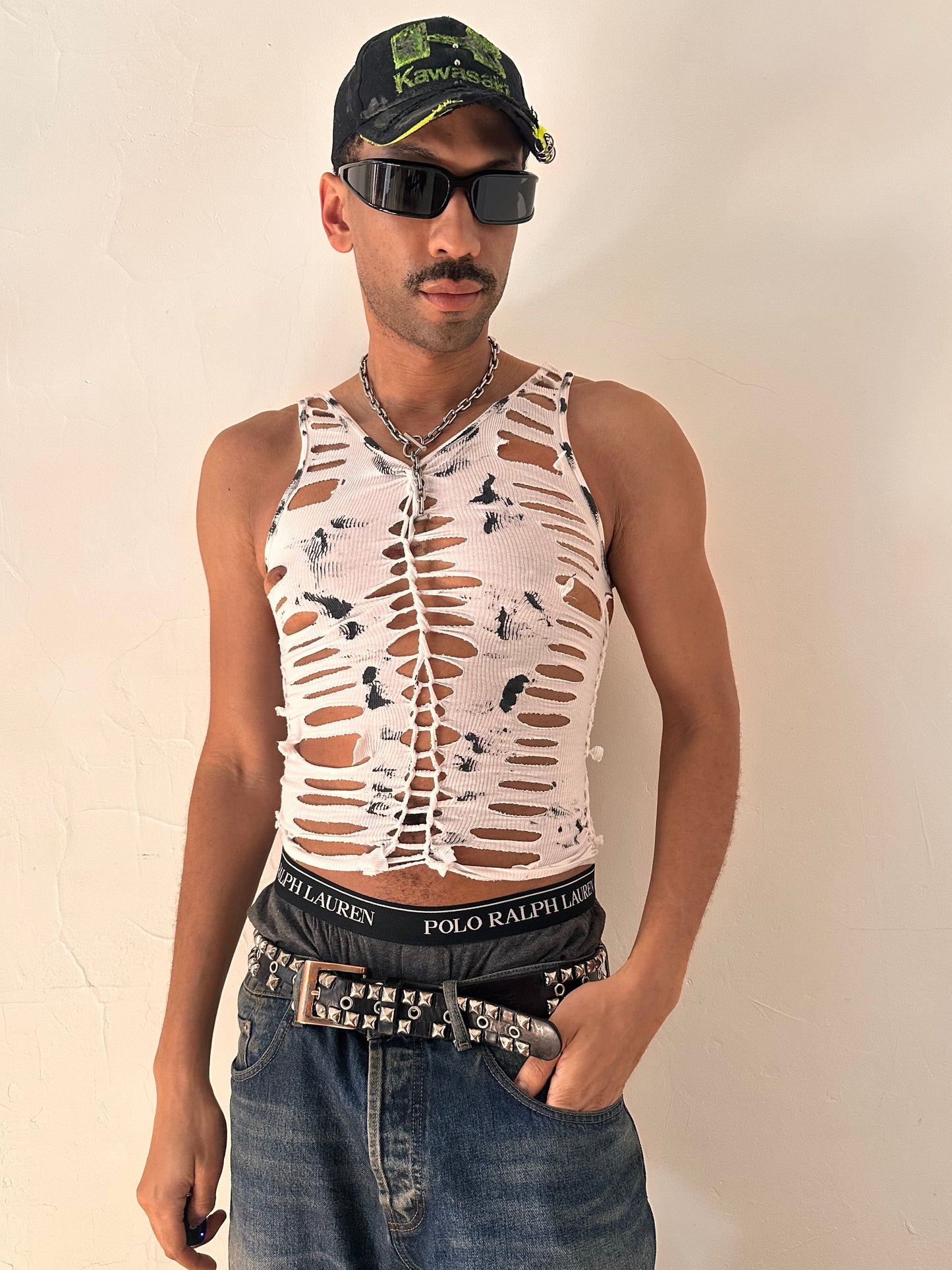Male model wearing ASTROBOI* 'Marble' white braided painted twist tank top, styled full look, ASTROBOI* STUDIO NYC.