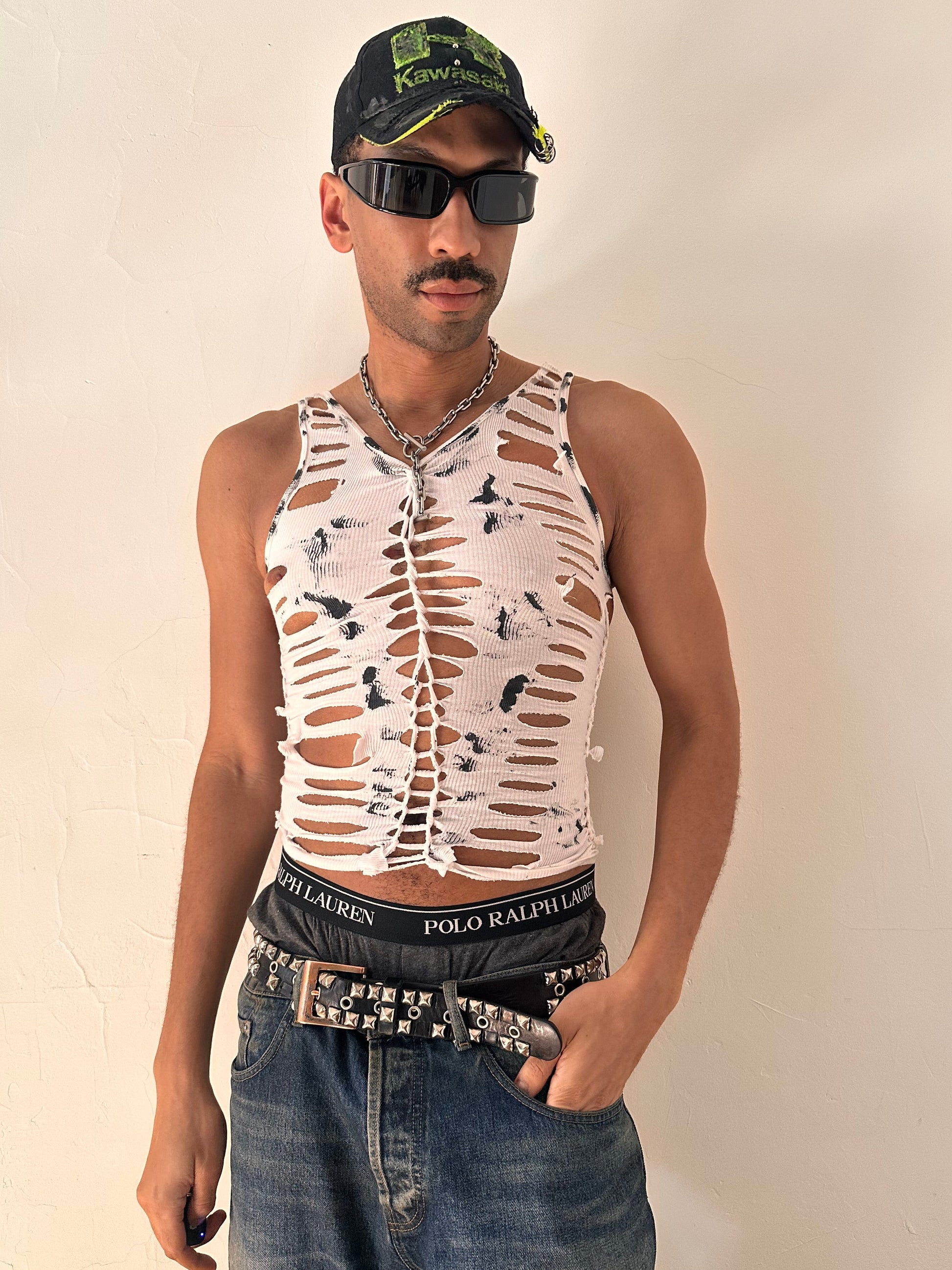 Male model wearing ASTROBOI* 'Marble' white braided painted twist tank top, styled full look, ASTROBOI* STUDIO NYC.