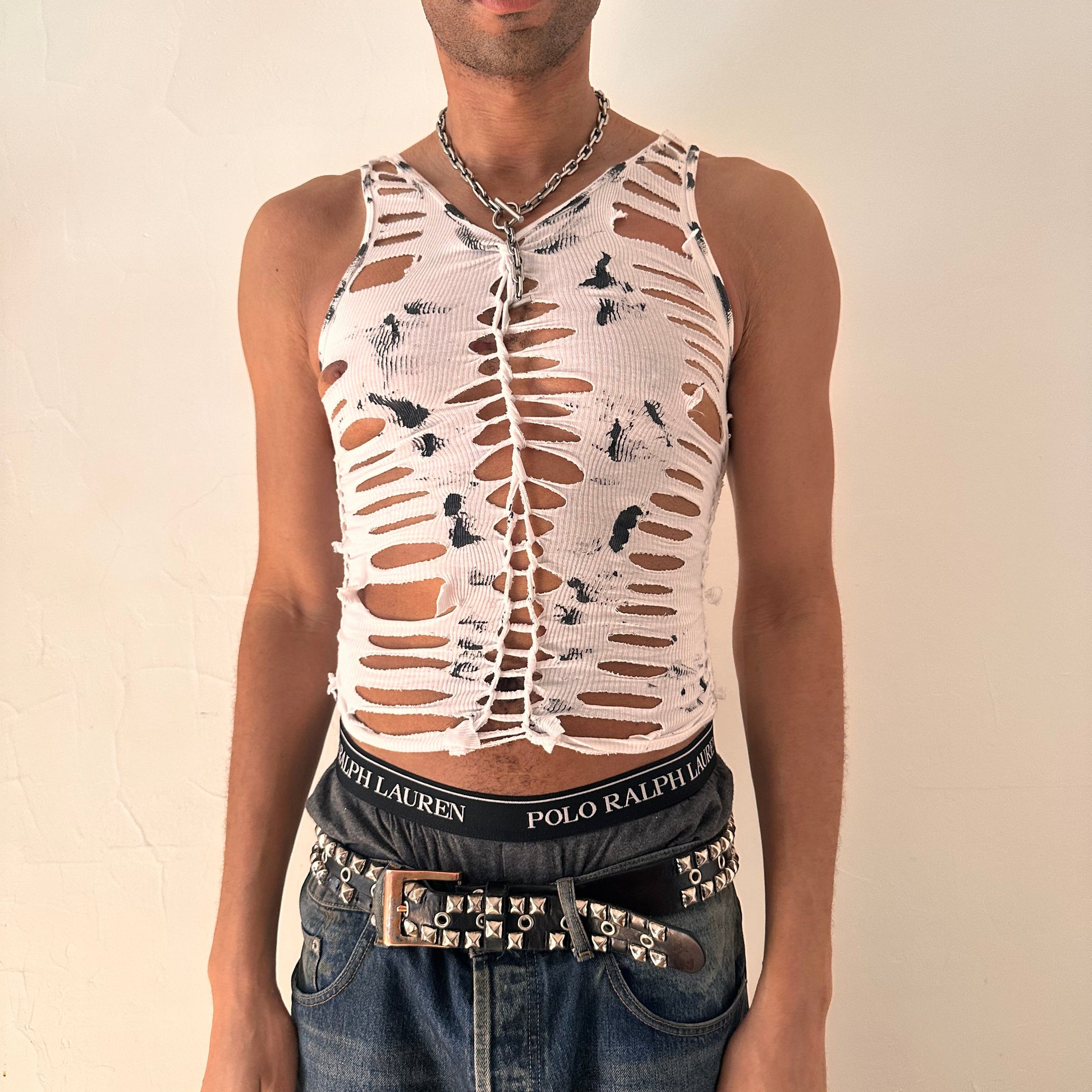 ASTROBOI* 'Marble' white form-fitting braided twist tank top with hand-braided arrangement, slash detailing, and black paint design throughout, front view.