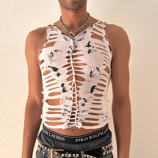 ASTROBOI* 'Yin Yang' white slim-fitting braided twist tank top with hand-braided arrangement, slashes, knots, and black paint smudge design, front view.