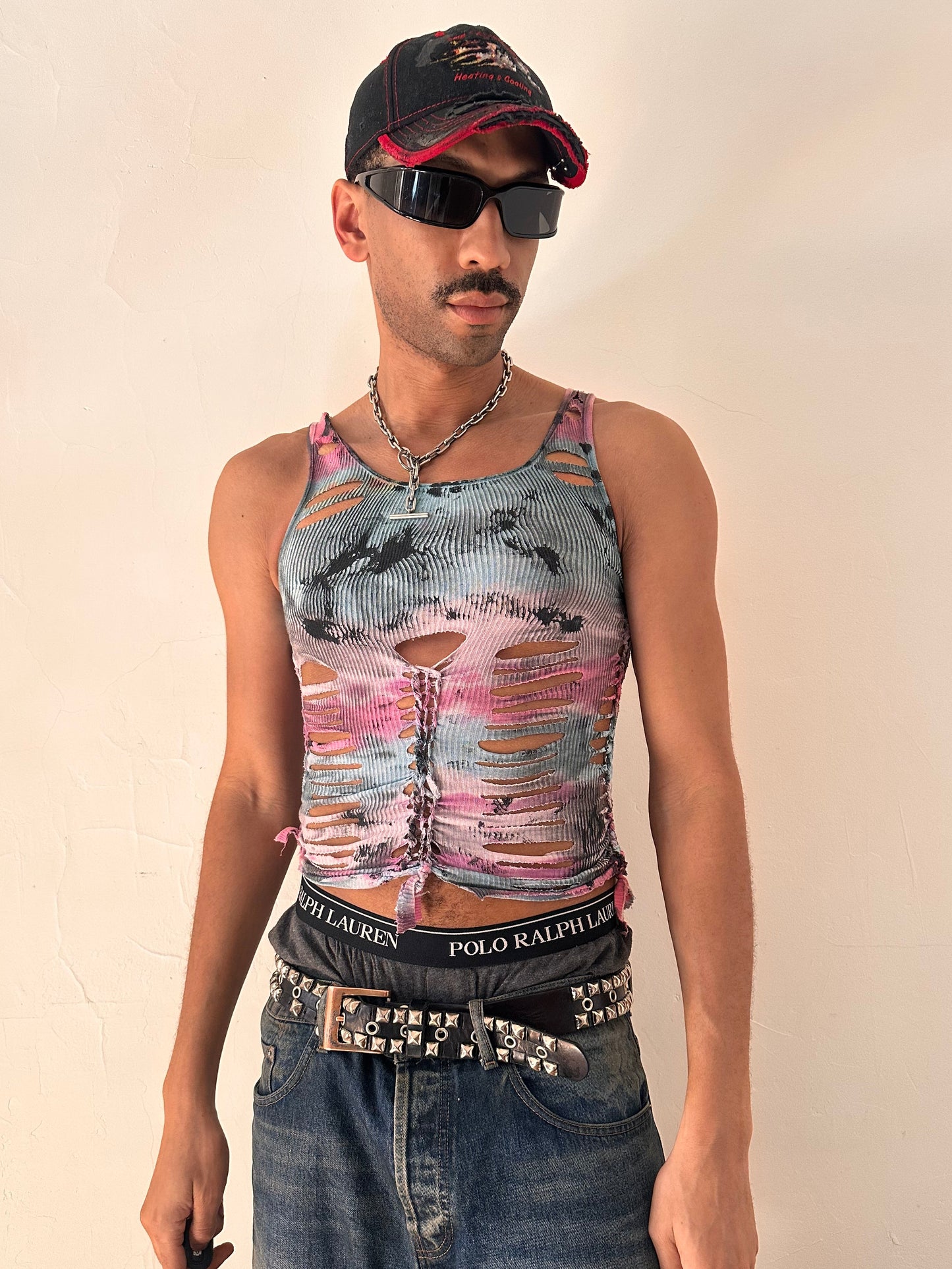 Male model wearing ASTROBOI* x Fruit of the Loom 'Sunrise' pink and blue tie dye braided twist tank top, styled full look, ASTROBOI* STUDIO Brooklyn NYC.