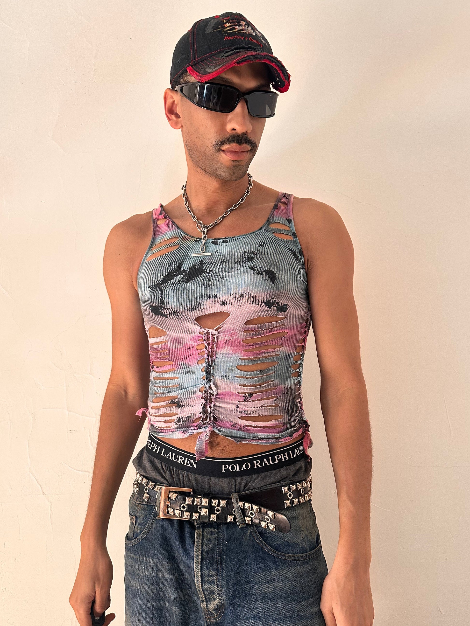 Male model wearing ASTROBOI* x Fruit of the Loom 'Sunrise' pink and blue tie dye braided twist tank top, styled full look, ASTROBOI* STUDIO Brooklyn NYC.