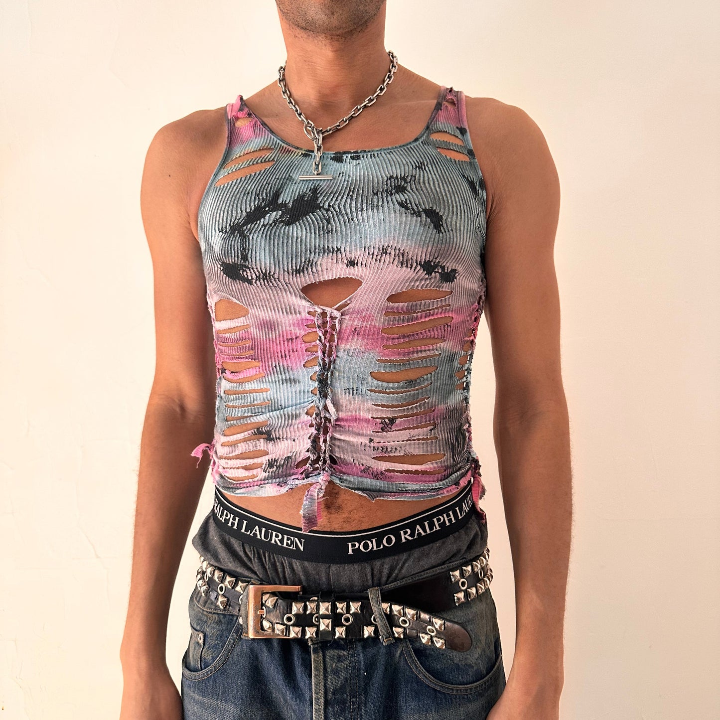 ASTROBOI* x Fruit of the Loom 'Sunrise' pink and blue tie dye braided twist tank top with black tar paint overlay and hand-braided detailing throughout, front view.
