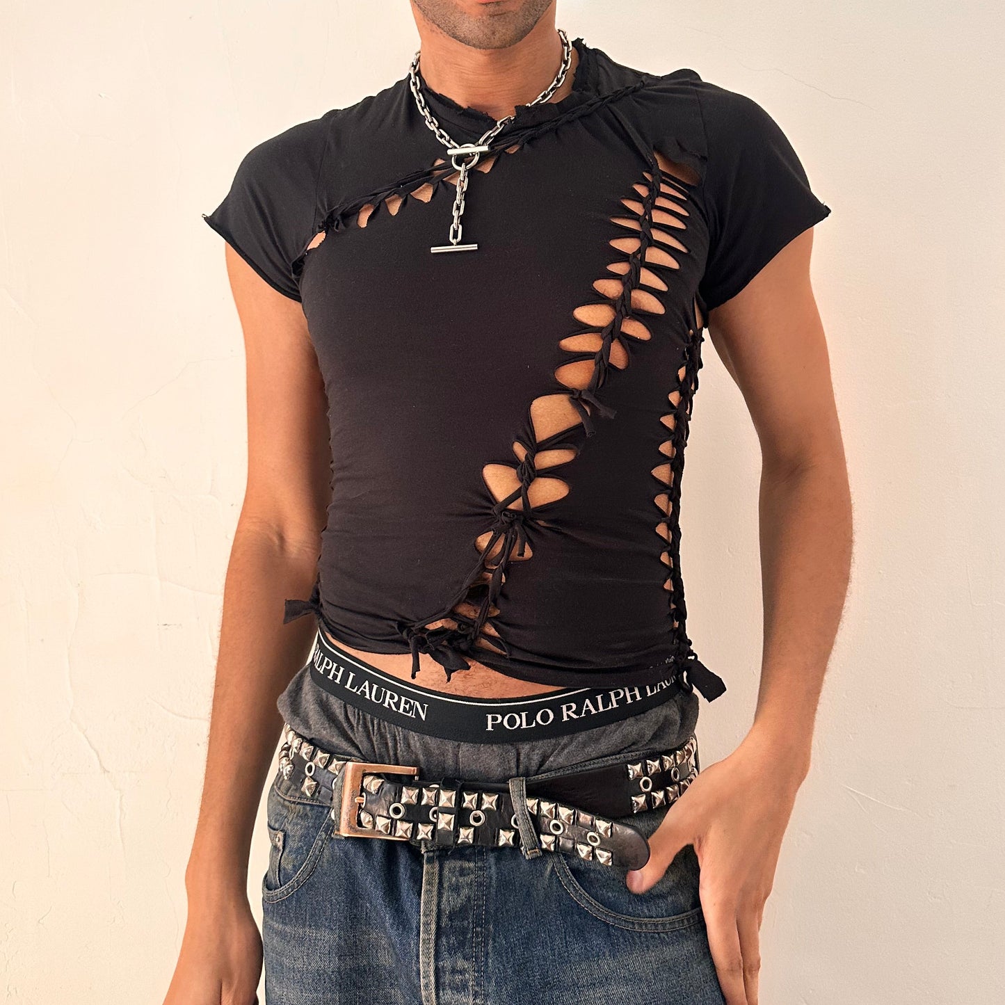 Cover image of ASTROBOI* x Calvin Klein black braided twist T-shirt in small with custom braided detailing and logo, soft cotton, NYC streetwear design.
