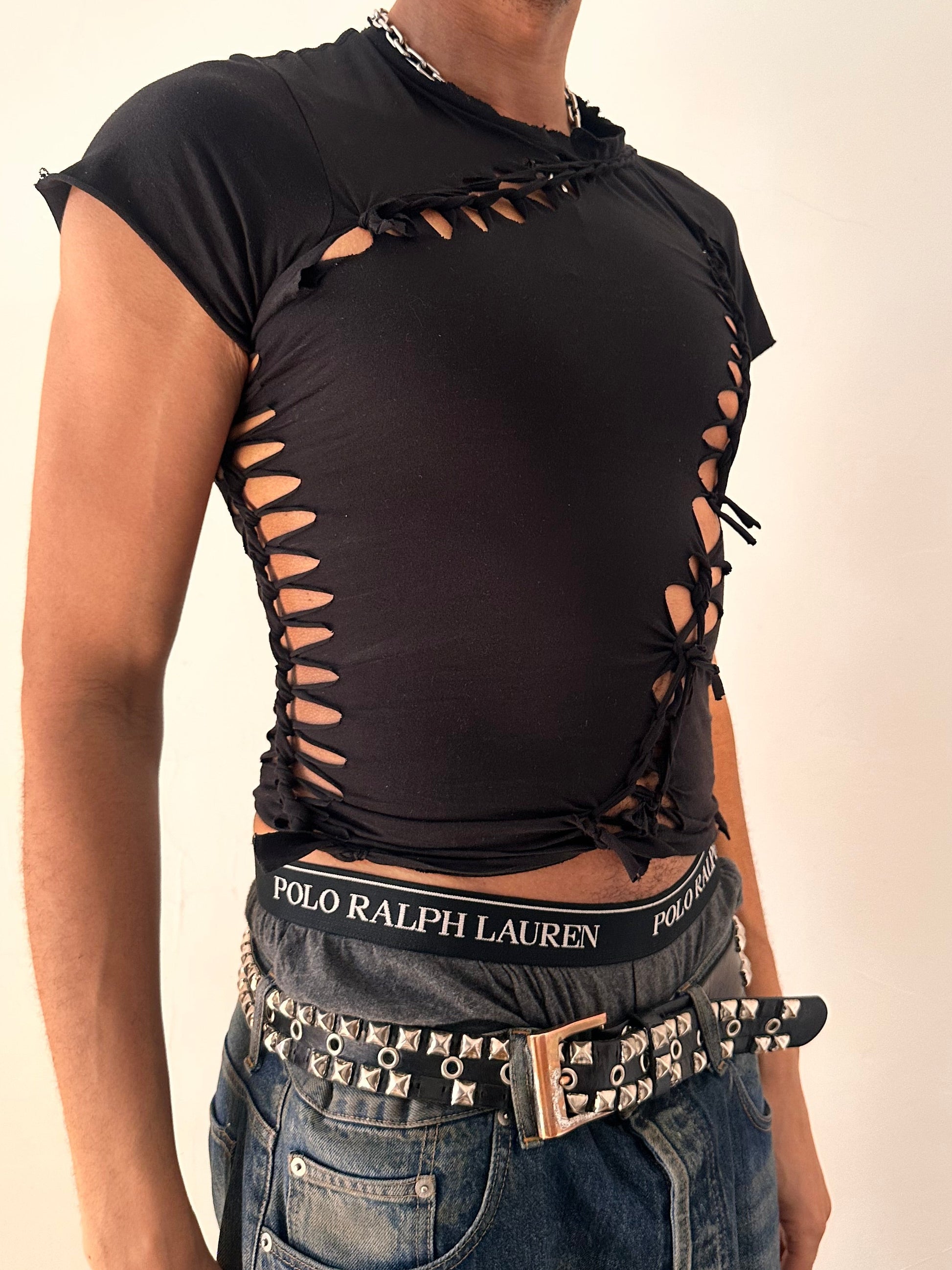 Close up of ASTROBOI* x Calvin Klein black braided twist T-shirt in small with custom braided detailing and logo, soft cotton, NYC streetwear design.