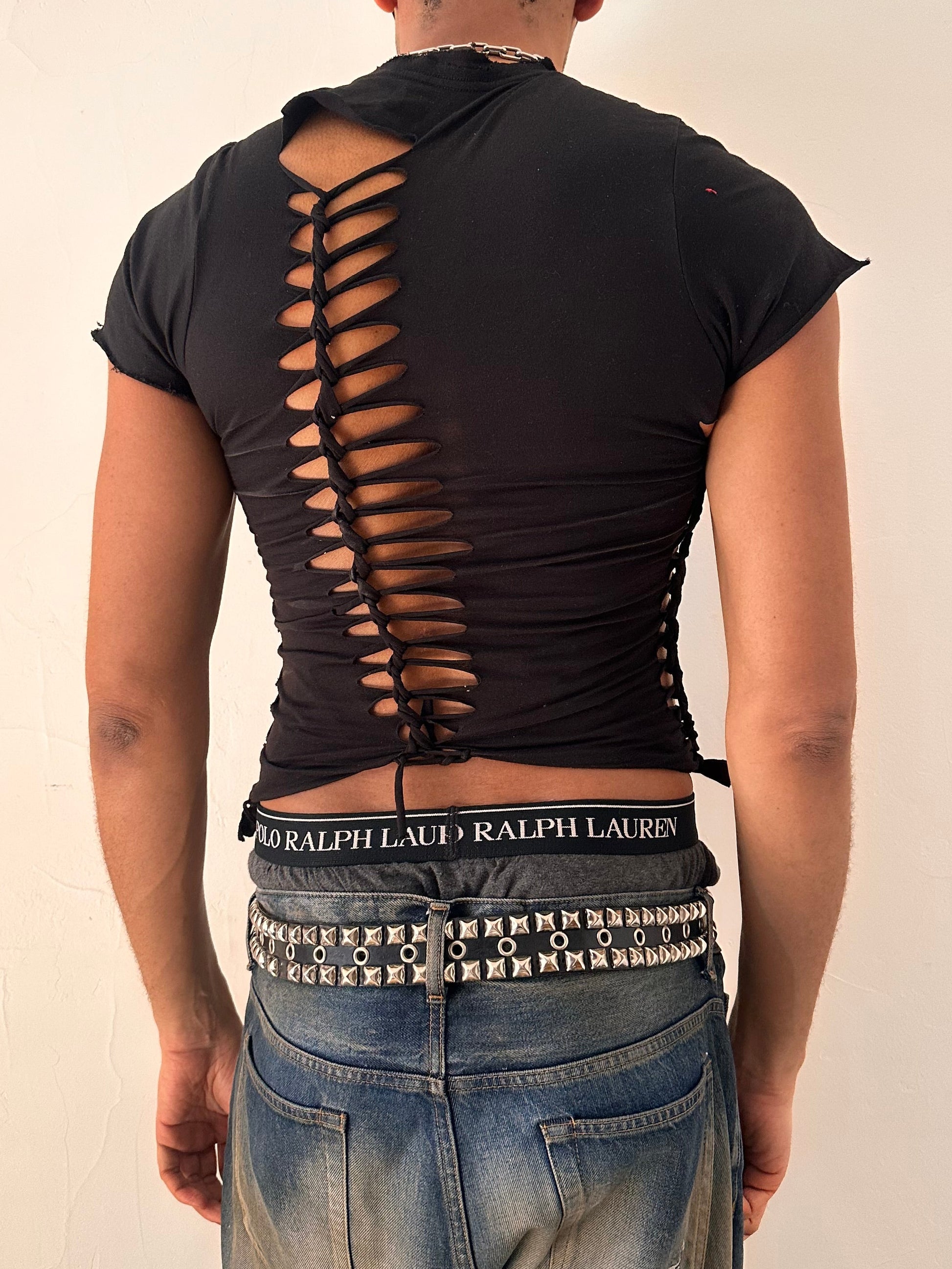 Back of ASTROBOI* x Calvin Klein black braided twist T-shirt in small with custom braided detailing and logo, soft cotton, NYC streetwear design.