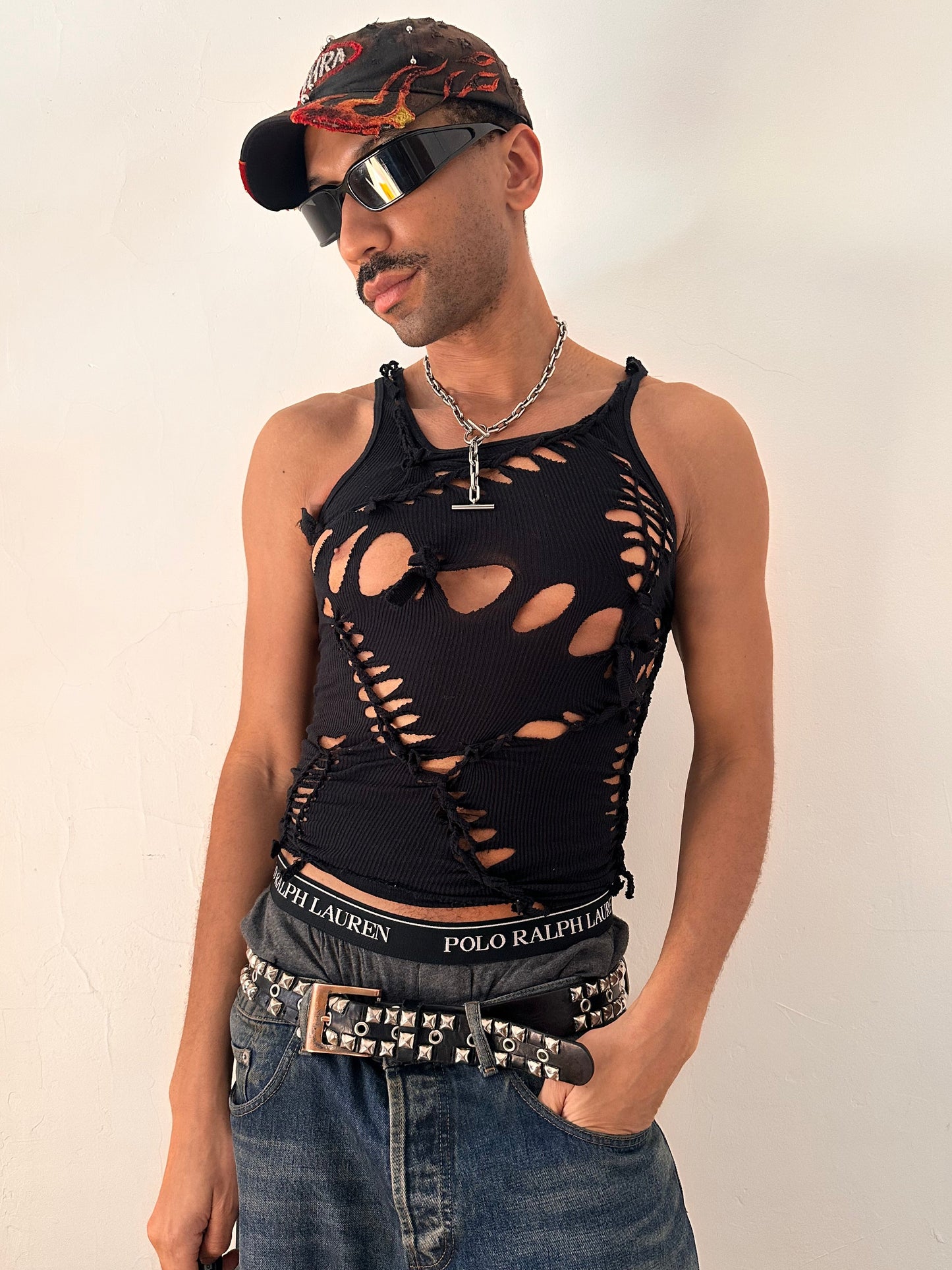 Styled image of ASTROBOI* All Open black braided twist tank top with white painted design and slash detailing, form fitting silhouette, size Medium