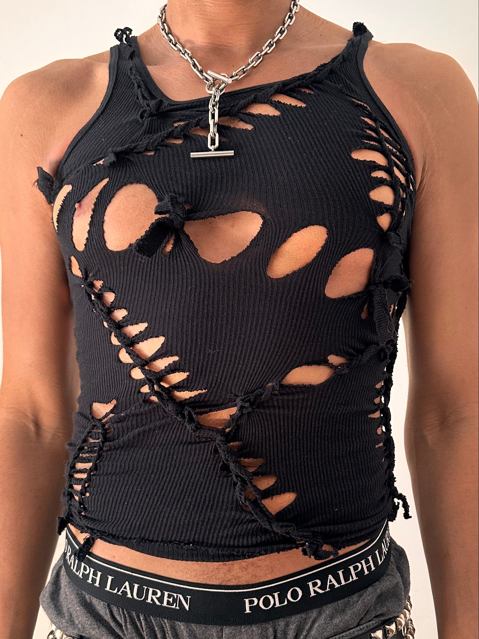 Close up of ASTROBOI* All Open black braided twist tank top with white painted design and slash detailing, form fitting silhouette, size Medium