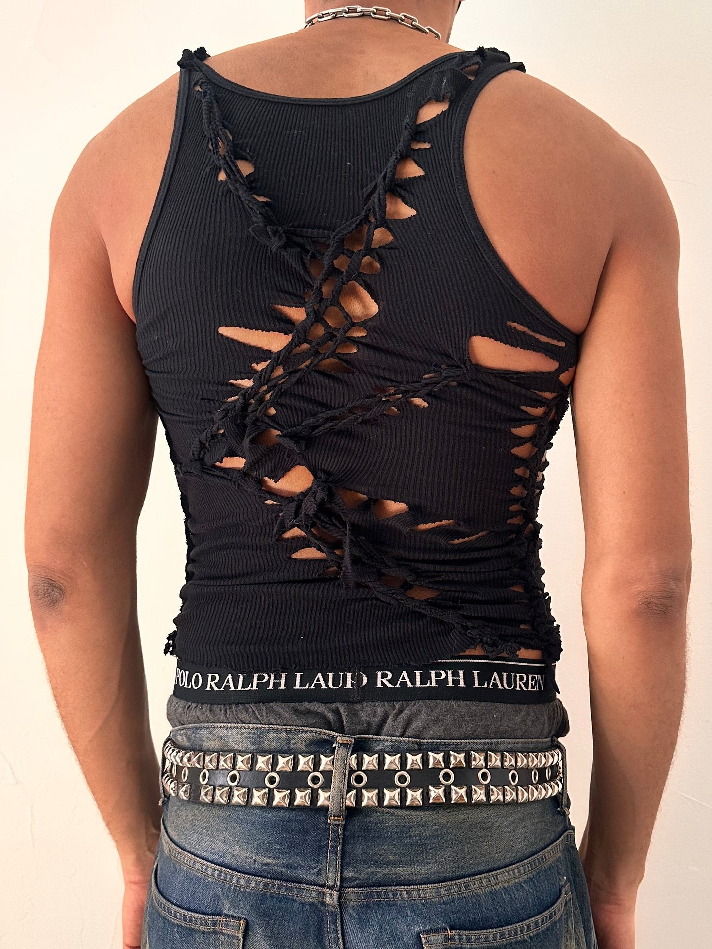 Back of ASTROBOI* All Open black braided twist tank top with white painted design and slash detailing, form fitting silhouette, size Medium
