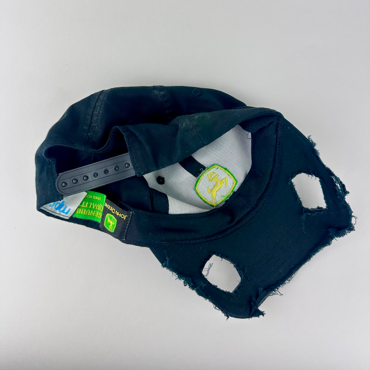 ASTROBOI* x John Deere 'Hyland' black distressed cut out hat, rear view showing adjustable strap back.