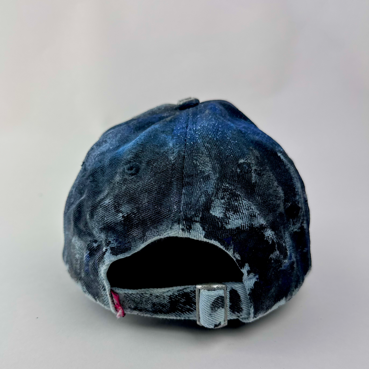 ASTROBOI* x Levi's 'Blacked Out' blue and black grunge denim hat, rear view showing adjustable strap back.