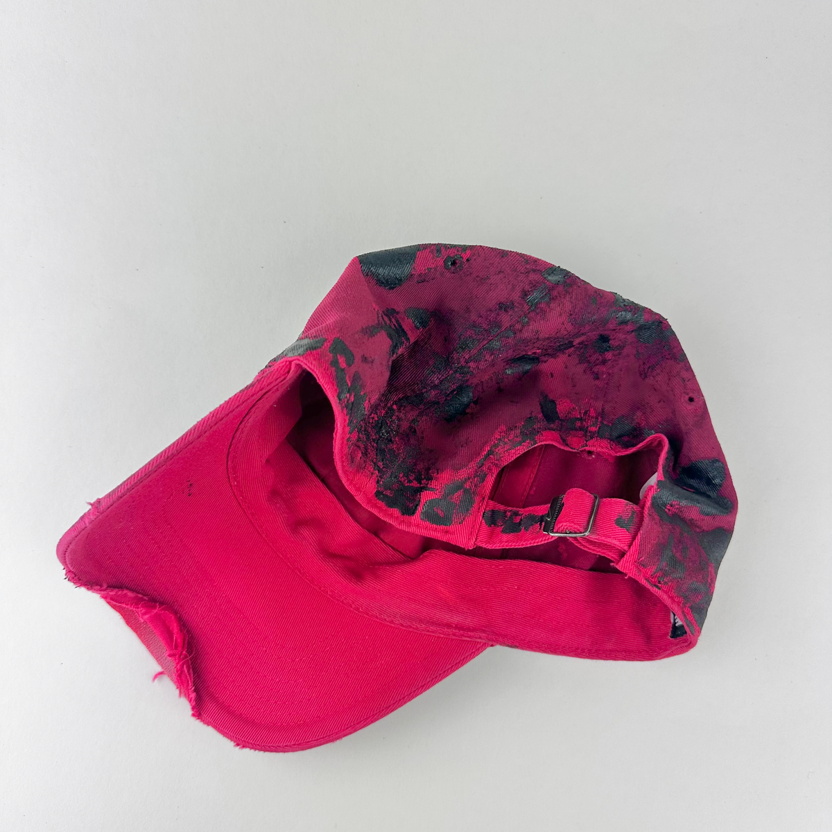 ASTROBOI* x Nike 'Comet' red and black painted distressed rhinestone hat, rear view showing adjustable back.