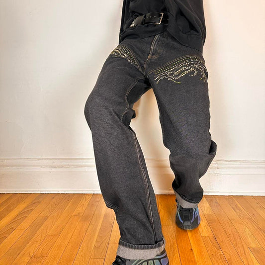 Cover photo of Y/PROJECT black western cowboy jeans with green and clear rhinestones along both legs, straight-leg fit, size 36x32