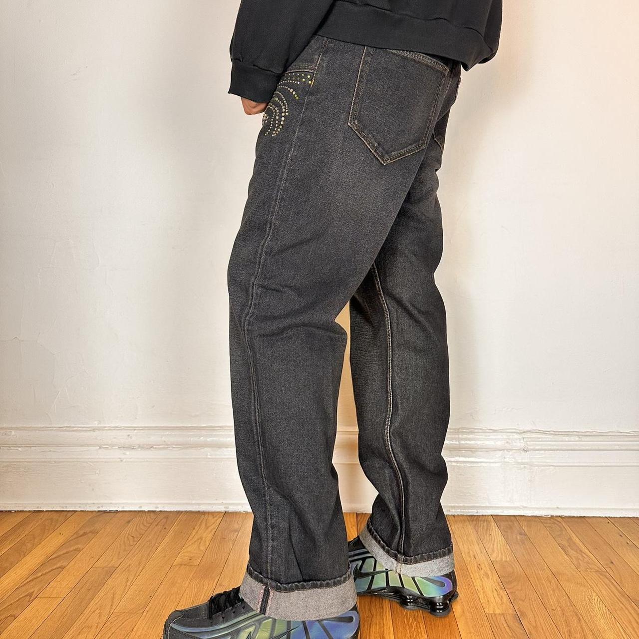 Left side of Y/PROJECT black western cowboy jeans with green and clear rhinestones along both legs, straight-leg fit, size 36x32