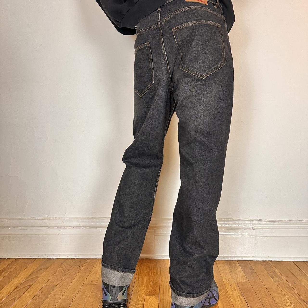 Back side of Y/PROJECT black western cowboy jeans with green and clear rhinestones along both legs, straight-leg fit, size 36x32