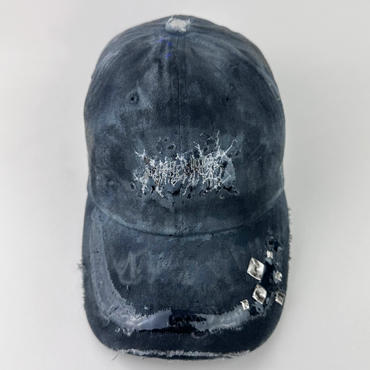 ASTROBOI* 'Slick' black and gray indie studded cap with white indie barbed wire logo at front, silver studded visor detail, and 3D resin coating, front view.