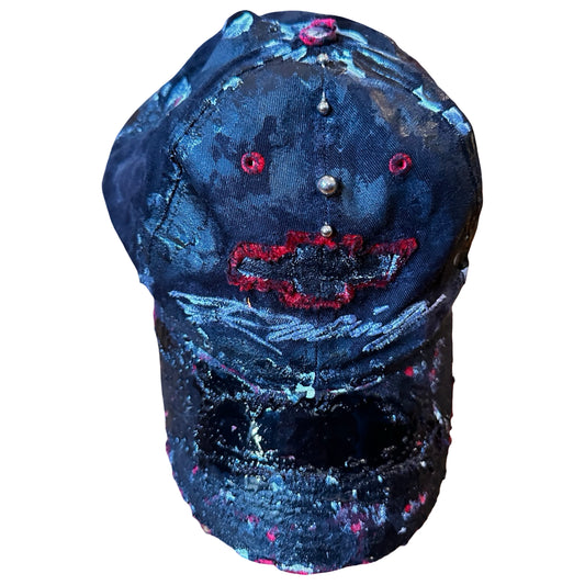 Front flat lay of Black and red Chevy Racing hat customized by ASTROBOI* with distressing, painted details, glossy resin visor, and stainless steel piercings.