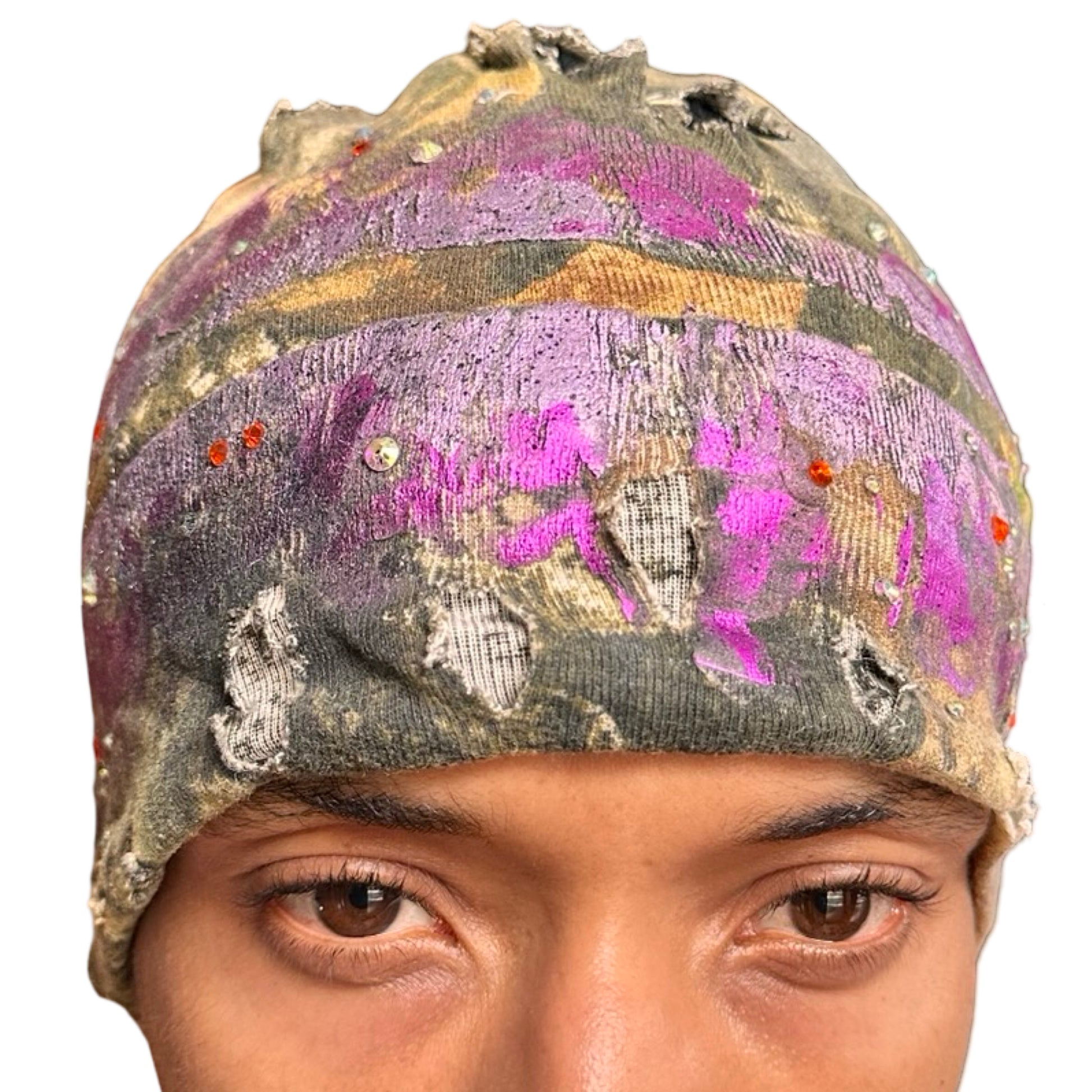 Front of ASTROBOI* brown RealTree grunge beanie with ripped details, lavender and magenta paint, and colorful rhinestones, handmade in NYC.