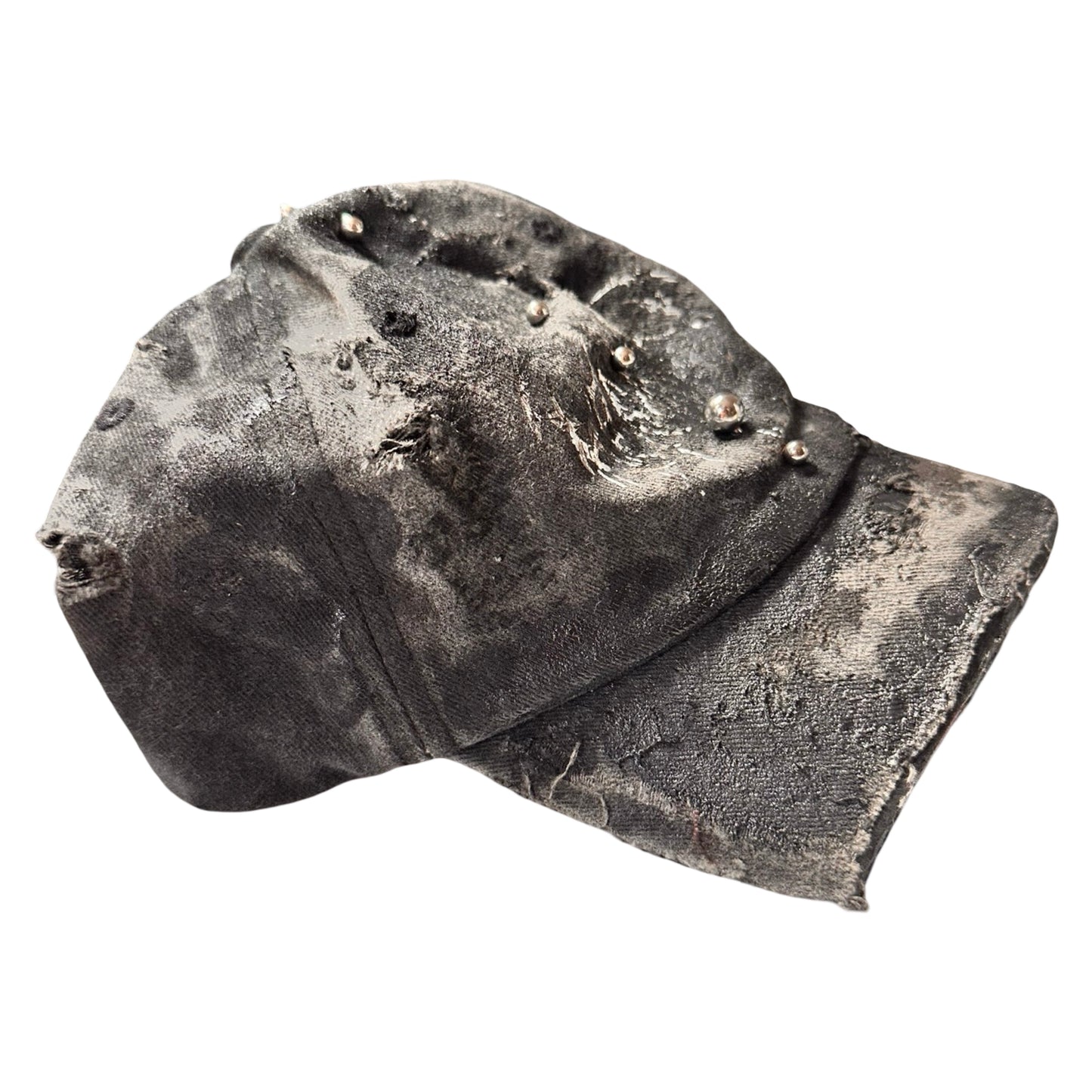 Flat right of Black distressed half-visor hat with barbed-wire logo, adjustable strap, black paint details, and stainless steel piercings along the brim.