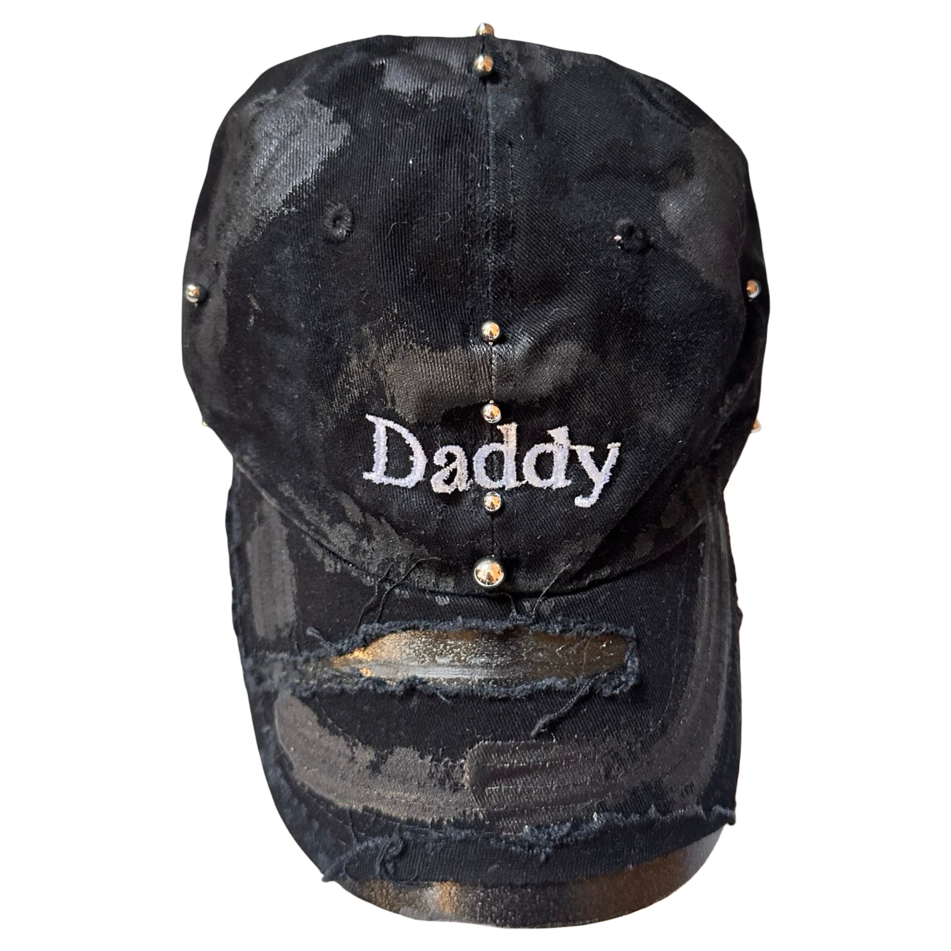 Overview of Black distressed ASTROBOI* ‘Daddy’ hat with custom paint detailing and stainless steel piercings, handcrafted in NYC.