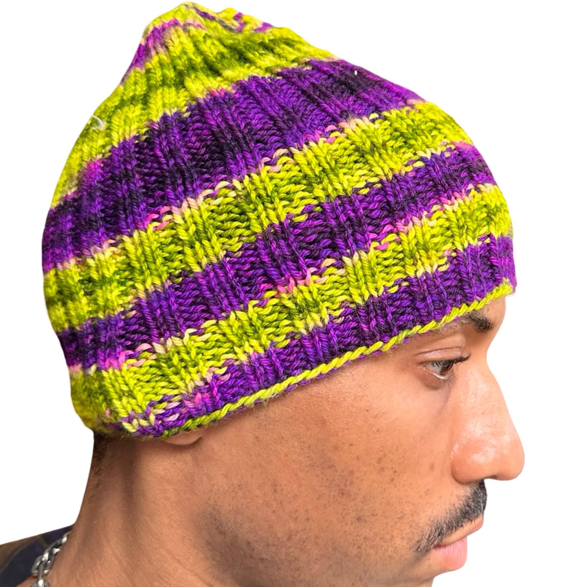 Right side of Vintage handknit purple and green striped beanie with ribbed acrylic knit and soft stretchy fit.