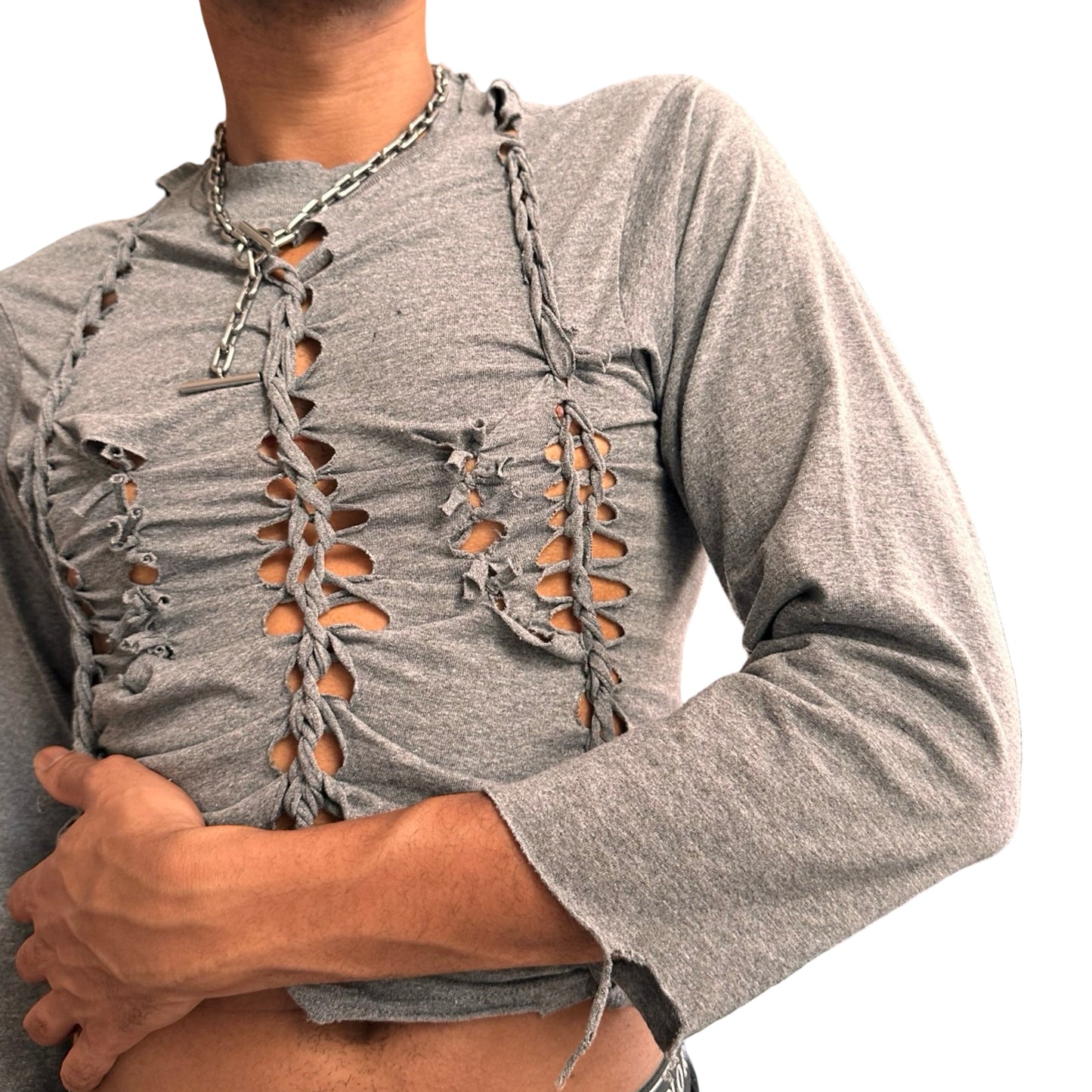 Front arm detail of ASTROBOI* x Gildan ‘Harness’ grey braided twist long sleeve shirt with tight body, loose sleeves, and hand-braided detailing. Custom NYC streetwear.