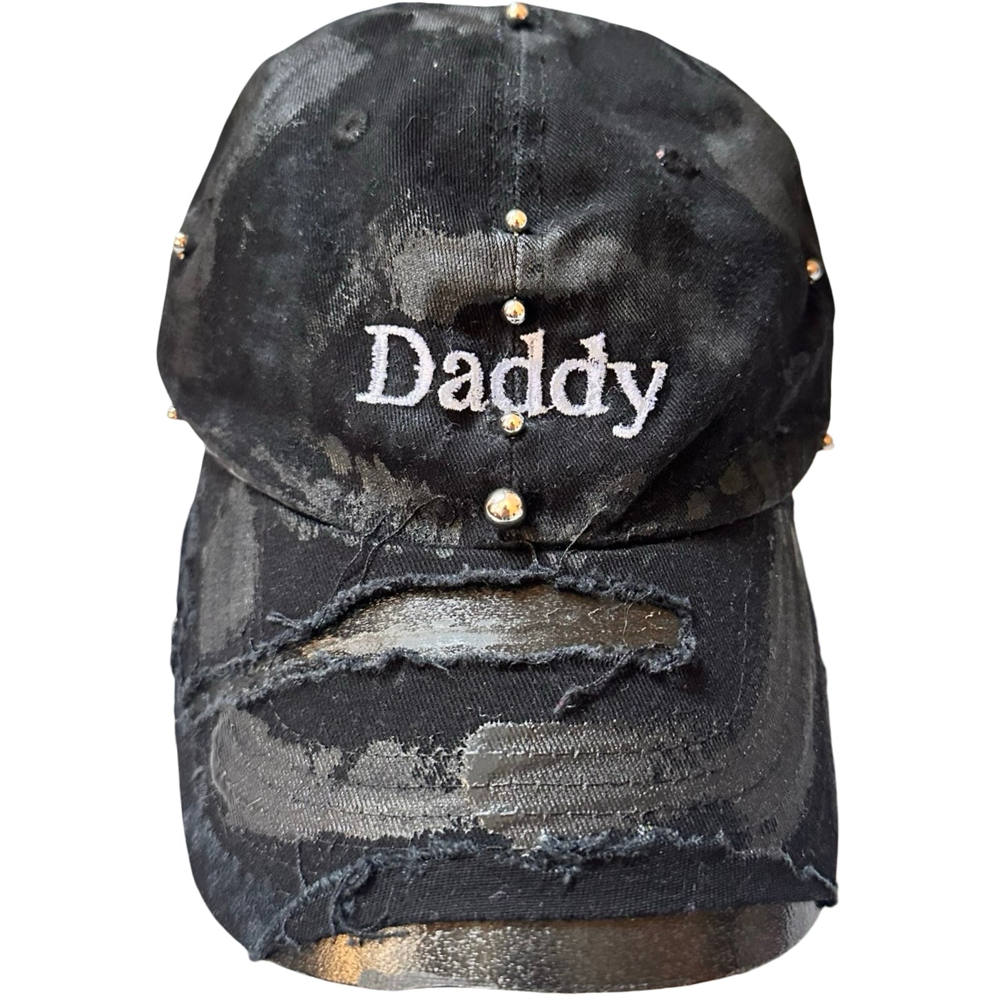 Flat front of Black distressed ASTROBOI* ‘Daddy’ hat with custom paint detailing and stainless steel piercings, handcrafted in NYC.