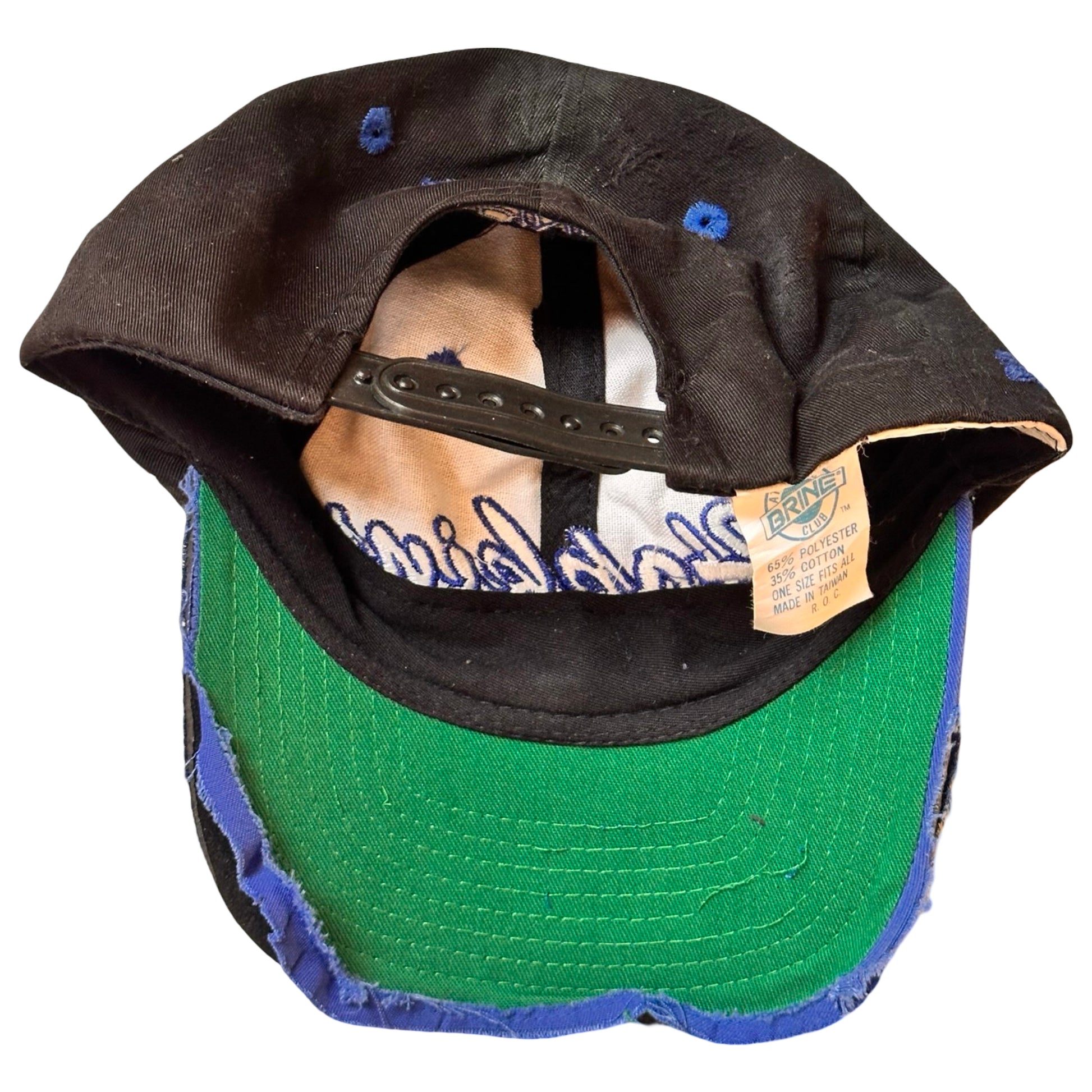 Flat back of Black distressed ASTROBOI* Hopkins Lacrosse cap with blue embroidery and custom black paint treatment, snapback style, handcrafted in NYC.