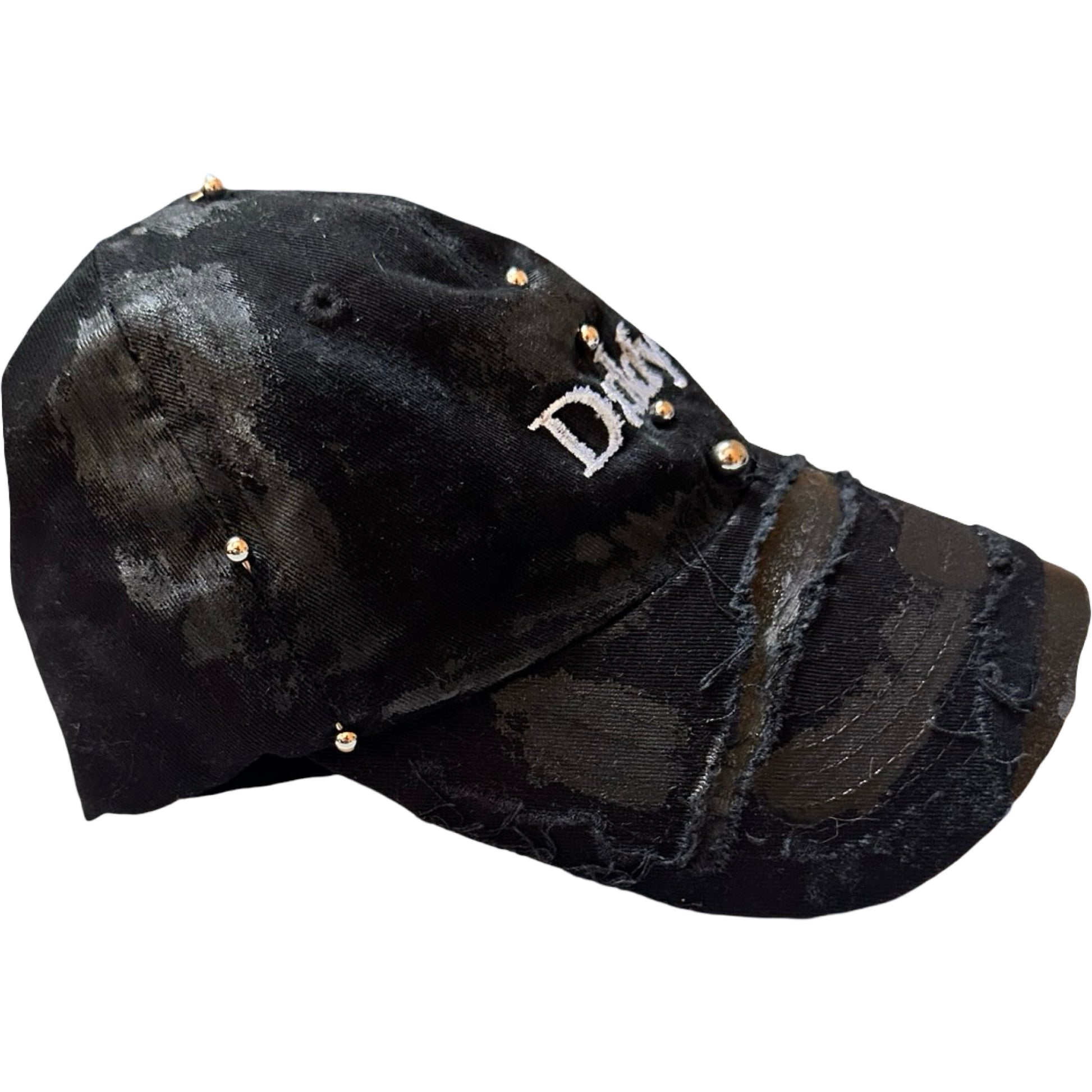 Flat right of Black distressed ASTROBOI* ‘Daddy’ hat with custom paint detailing and stainless steel piercings, handcrafted in NYC.