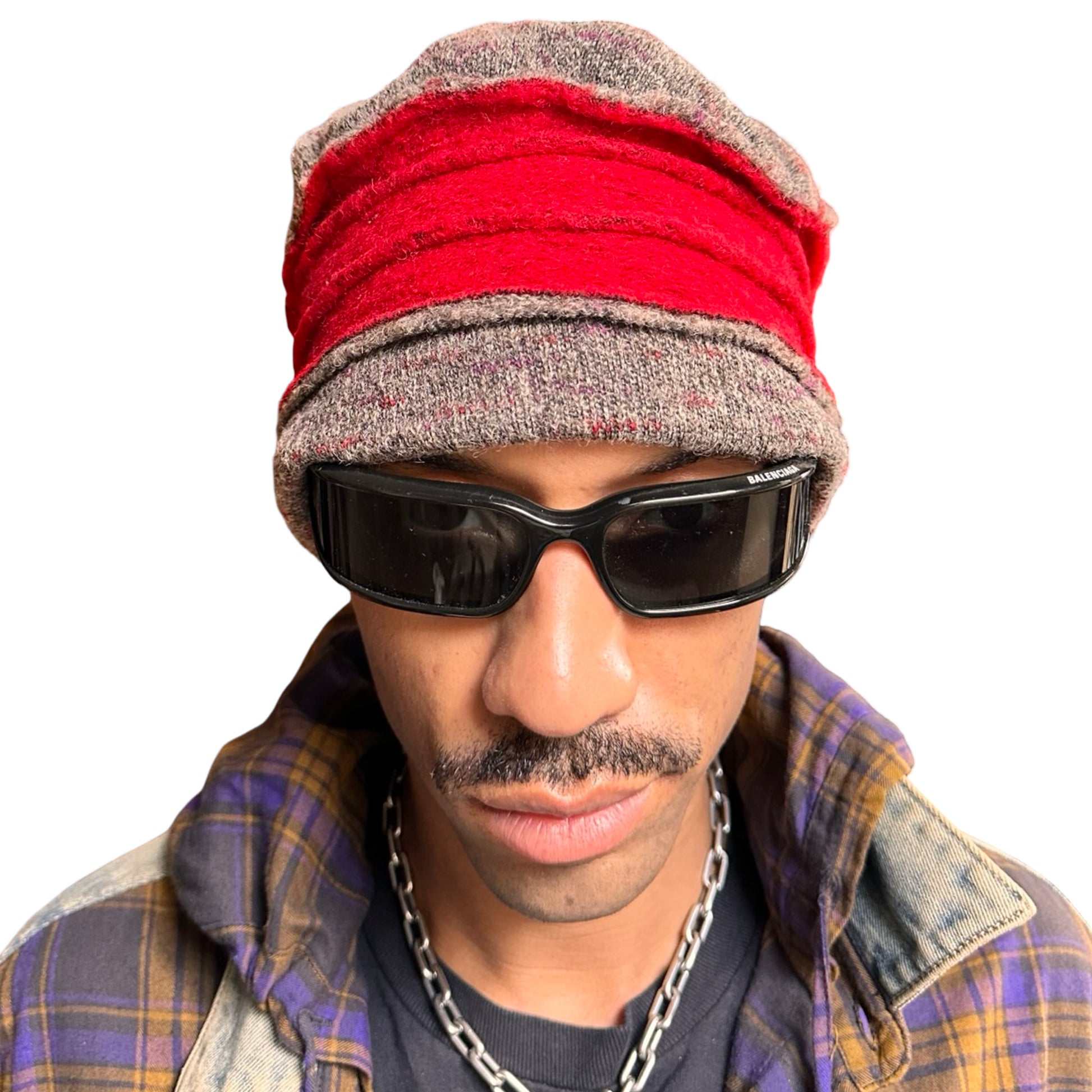 Front of ASTROBOI* red and grey pleated beanie with slouchy fit and patchwork panels, handmade in NYC.