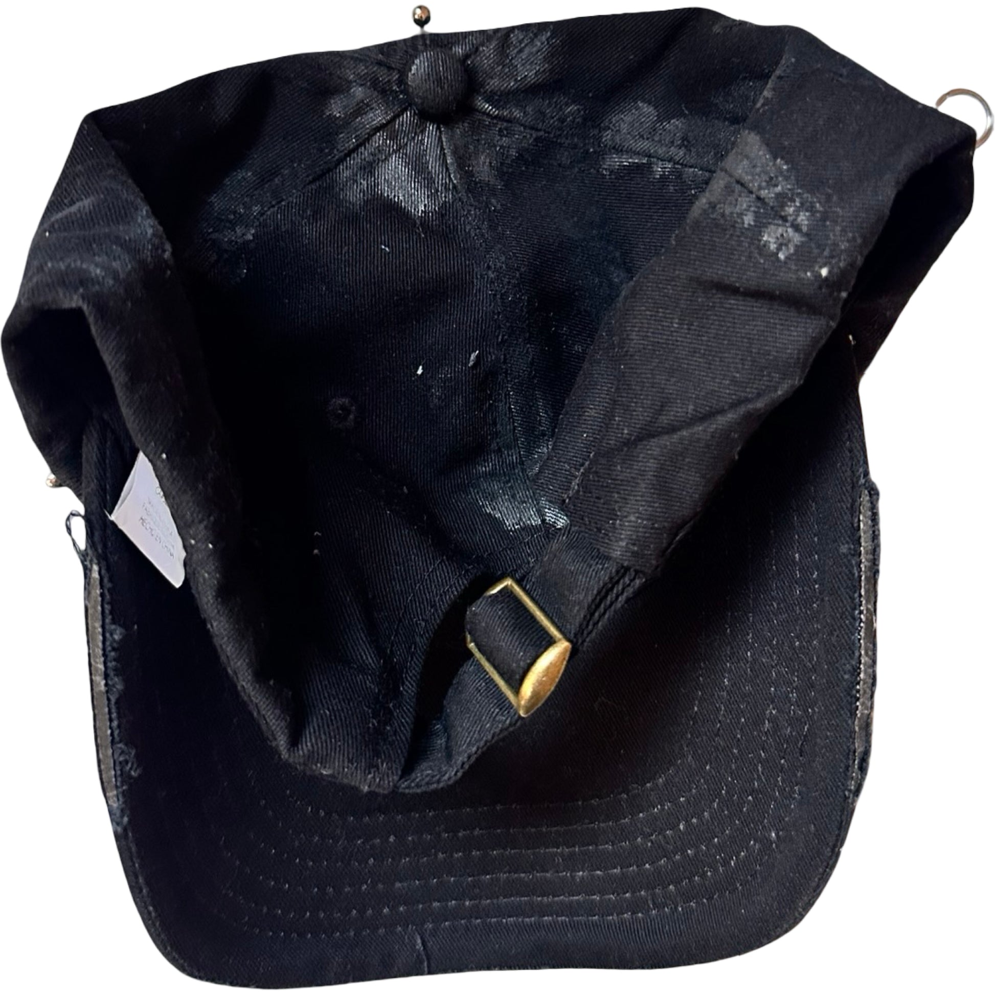 Flat back of Black distressed ASTROBOI* ‘Daddy’ hat with custom paint detailing and stainless steel piercings, handcrafted in NYC.