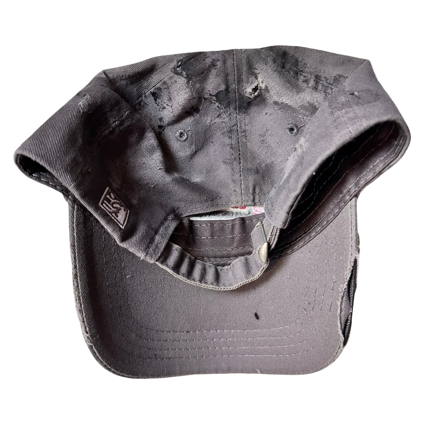 Flat back of Grey and pink distressed half-visor hat with ‘Los Angeles’ embroidery, black paint, and stainless steel piercings, customized by ASTROBOI*.
