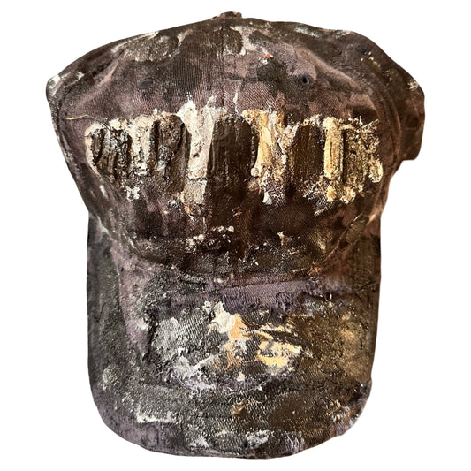 Flat front of ASTROBOI* navy fitted cap with custom black, white, and silver paint and distressed vintage finish.