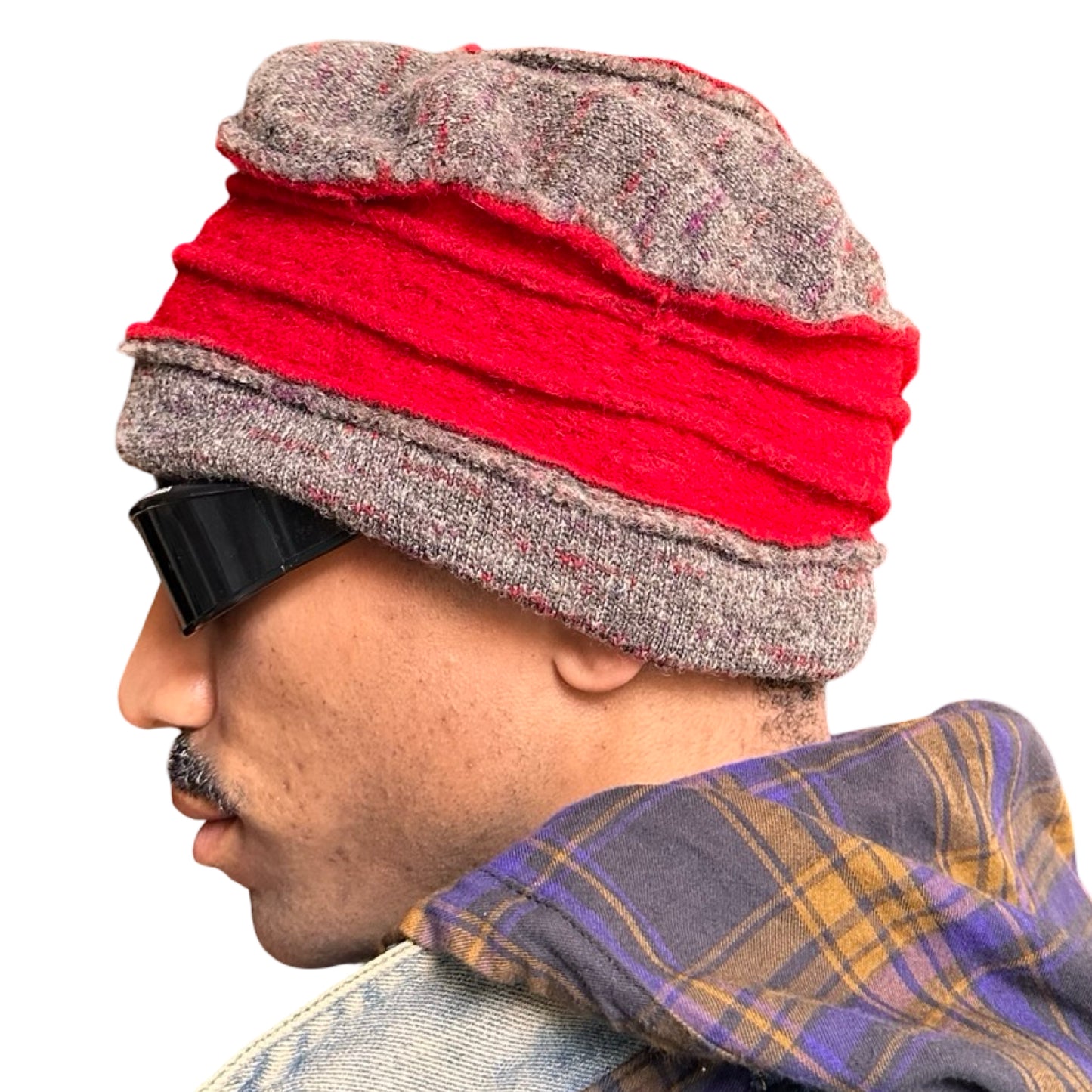 Left side of ASTROBOI* red and grey pleated beanie with slouchy fit and patchwork panels, handmade in NYC.