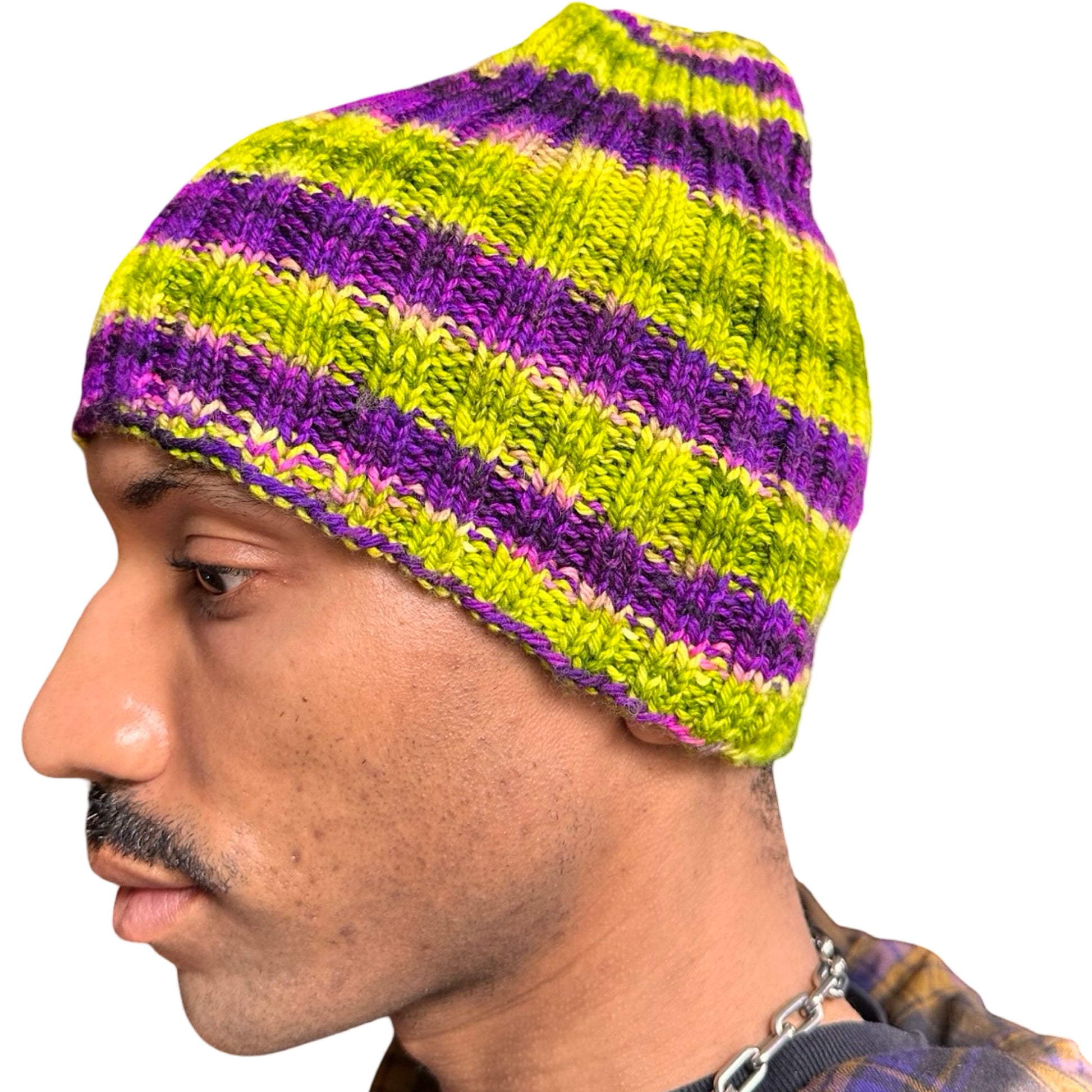 Left side of Vintage handknit purple and green striped beanie with ribbed acrylic knit and soft stretchy fit.