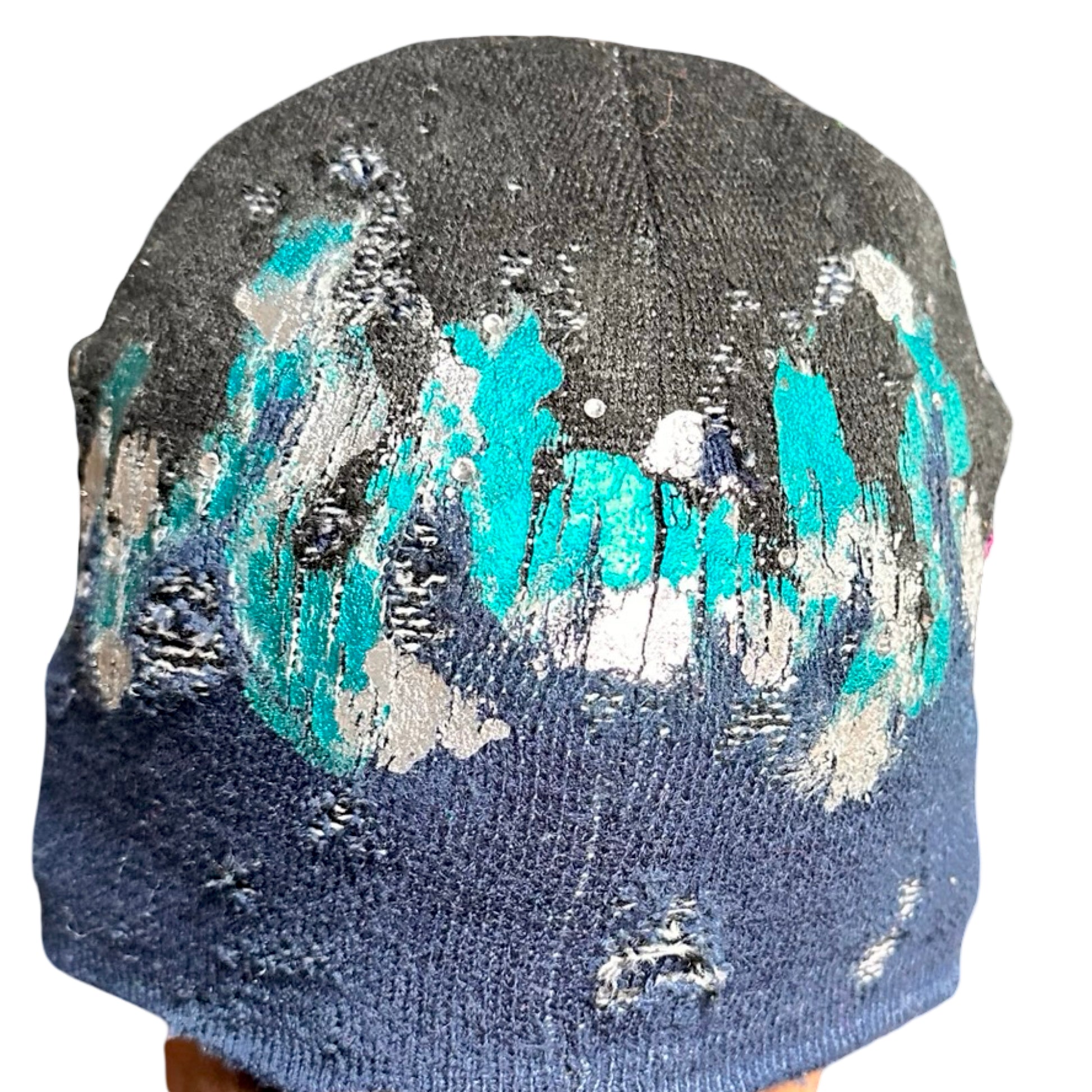 Back ASTROBOI* black and blue distressed flame beanie with metallic paint and tonal rhinestones. Custom acrylic knit hat handmade in NYC.