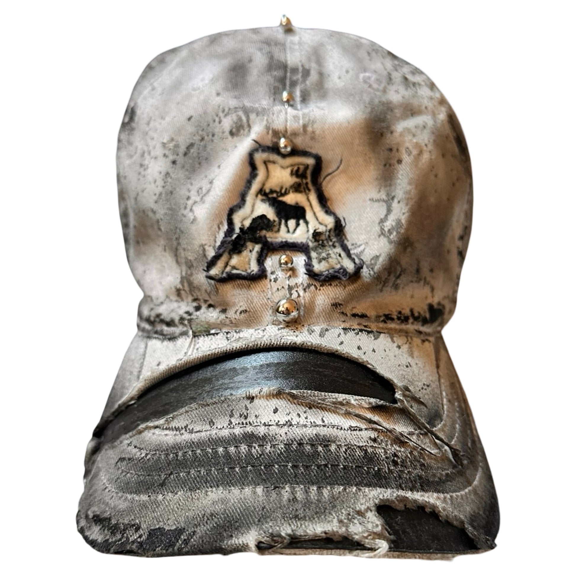 Flat front of Off-white and black faded ASTROBOI* x Abercrombie hat with custom paint treatment and stainless steel piercing, handmade in NYC.