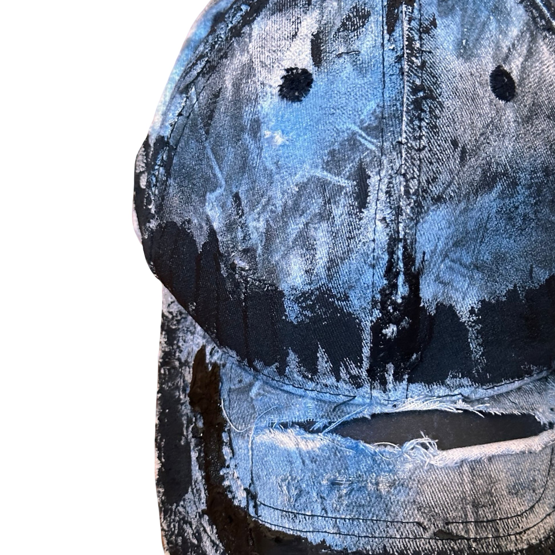 Front flat detail of ASTROBOI* white trompe l’oeil denim print hat with blue and black paint, resin accents, and distressed detailing.