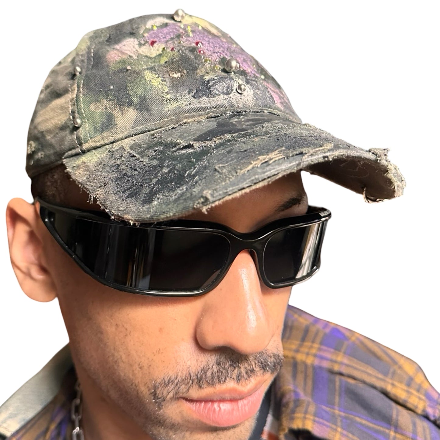 Front right of Green distressed hat with metallic rhinestones sealed in resin and stainless steel piercings, customized by ASTROBOI*.