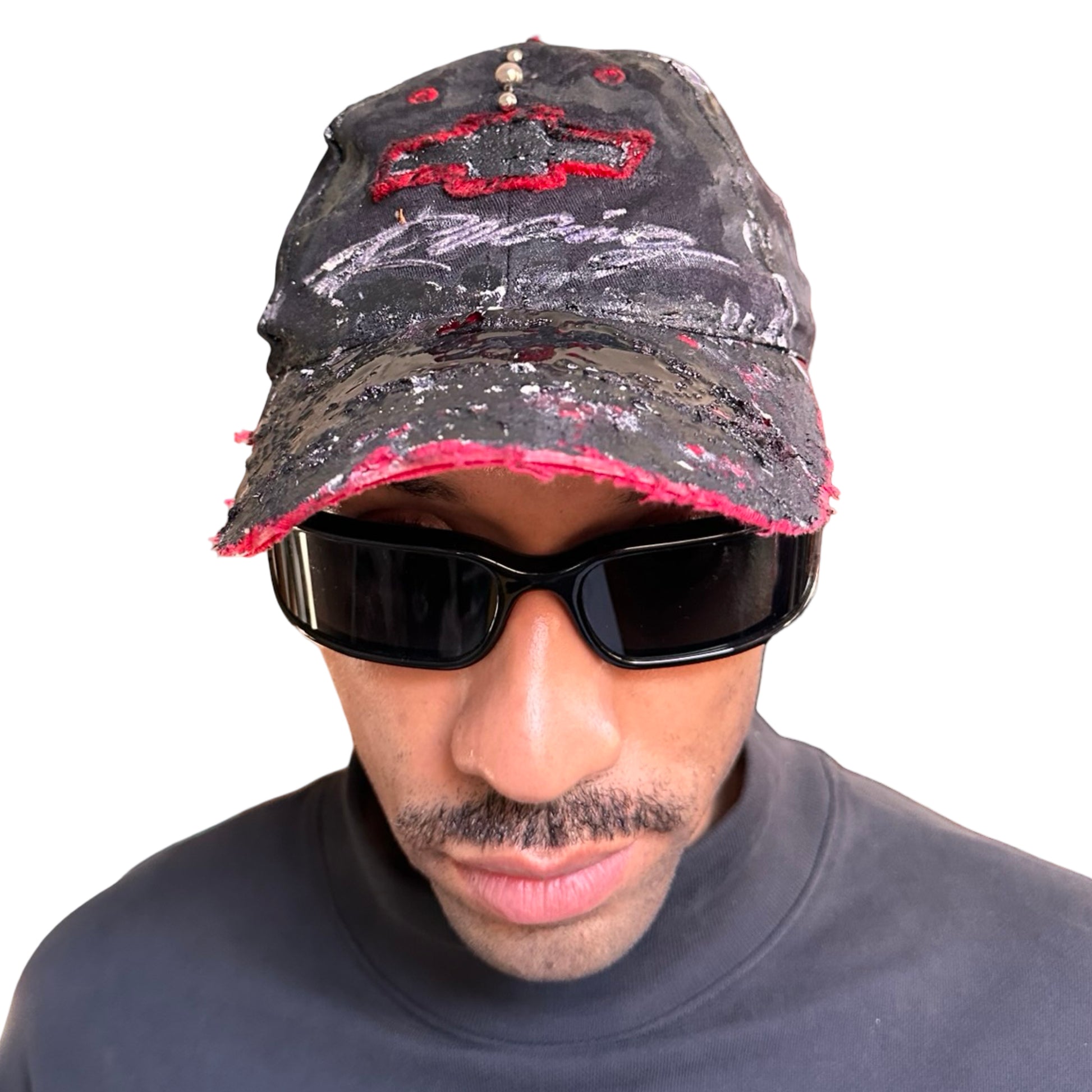 Front of Black and red Chevy Racing hat customized by ASTROBOI* with distressing, painted details, glossy resin visor, and stainless steel piercings.