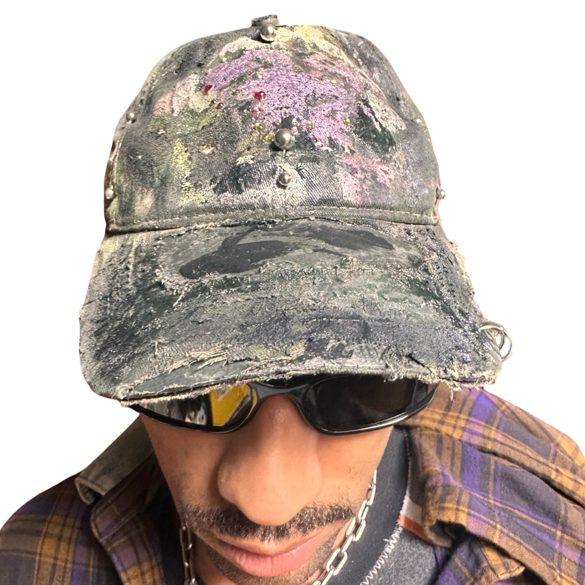 Front of Green distressed hat with metallic rhinestones sealed in resin and stainless steel piercings, customized by ASTROBOI*.