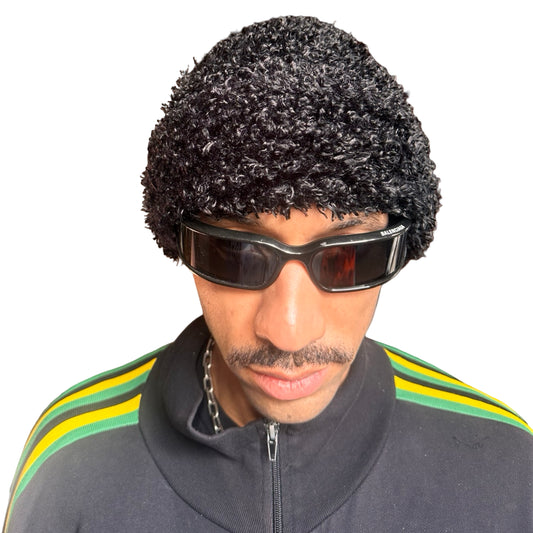 Front of Vintage black fuzzy chunky knit beanie with double-lined construction and thick textured fabric, shown in good condition.