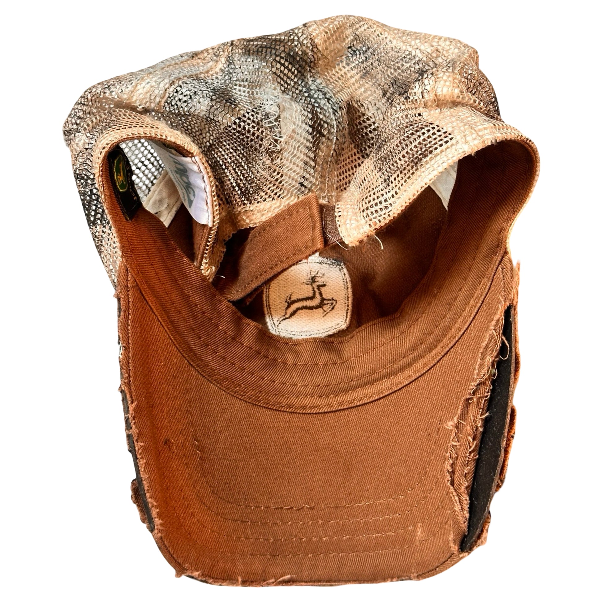 Flat back of ASTROBOI* x John Deere black and blue distressed trucker hat with rhinestone resin logo and stainless steel piercings.