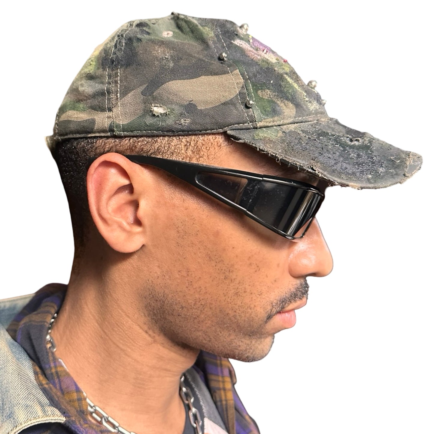 Right side of Green distressed hat with metallic rhinestones sealed in resin and stainless steel piercings, customized by ASTROBOI*.