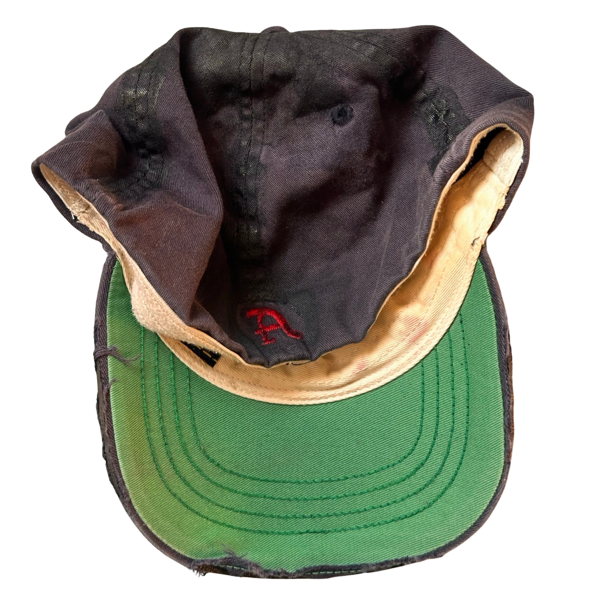 Flat back of Navy ASTROBOI* x Abercrombie hat with distressed paint, stainless steel piercings, and logo embroidery on front and back, customized in NYC.