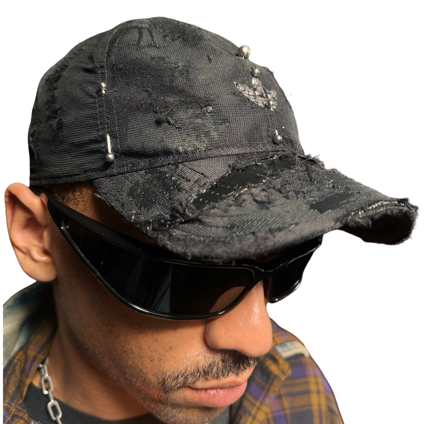 Front right of Black Adidas hat customized by ASTROBOI* with distressing, black painted accents, and stainless steel piercings.